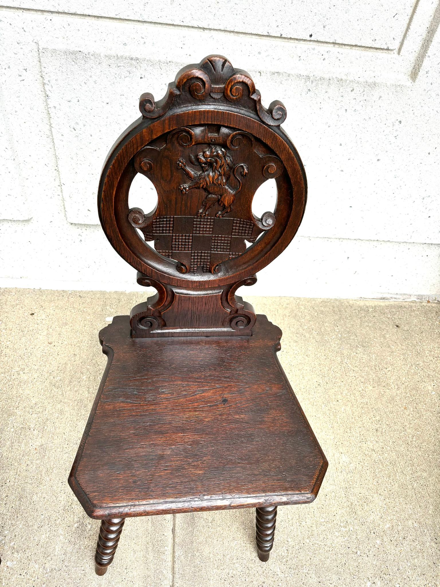 Hand-Carved Pair 18th Century Italian Chestnut Hall Chairs Carved With Lion Crests  For Sale