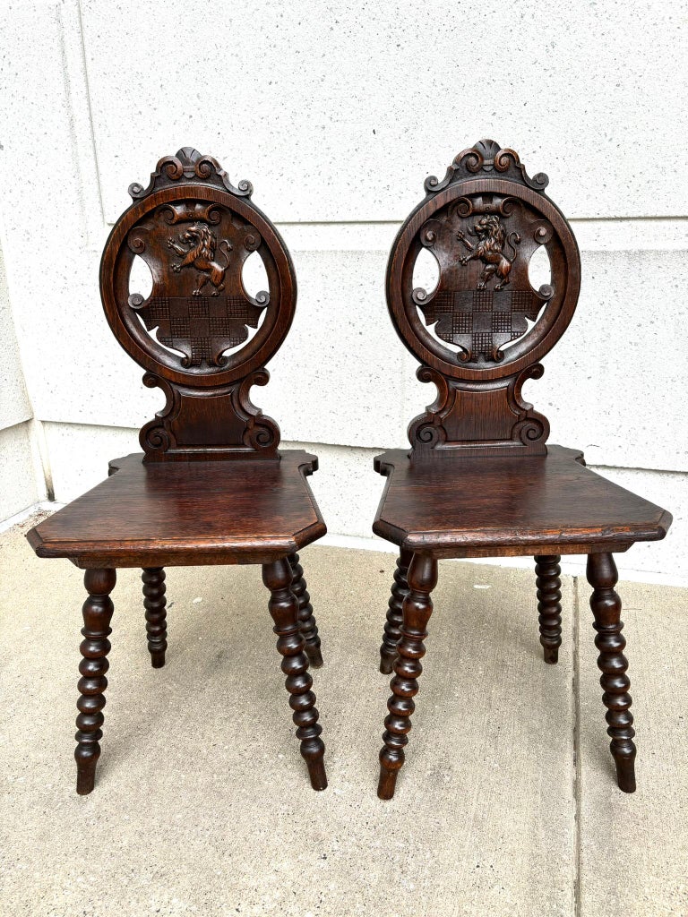 Pair 18th Century Italian Chestnut Hall Chairs Carved With Lion Crests Pair 18th Century Italian Chestnut Hall Chairs Carved With Lion Crests
