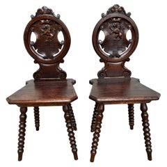 Pair 18th Century Italian Chestnut Hall Chairs Carved With Lion Crests 