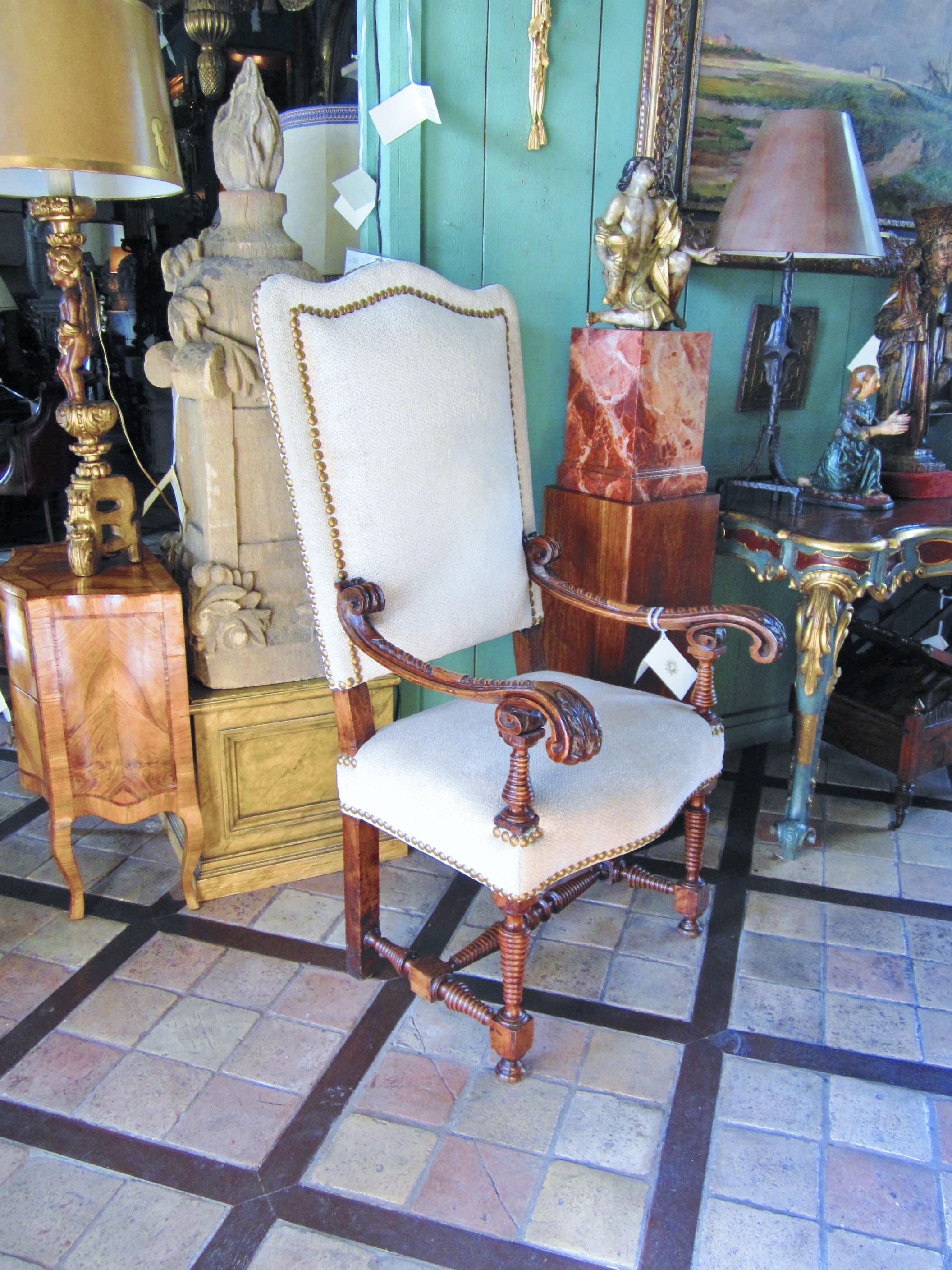 A very good pair of 18th century Hand carved walnut high back armchairs.
Classic designed walnut wood frame 18th century Italian side chairs.
Scroll arm and spool / turned legs. This pair of Chairs could be placed in an entryway a living room or a