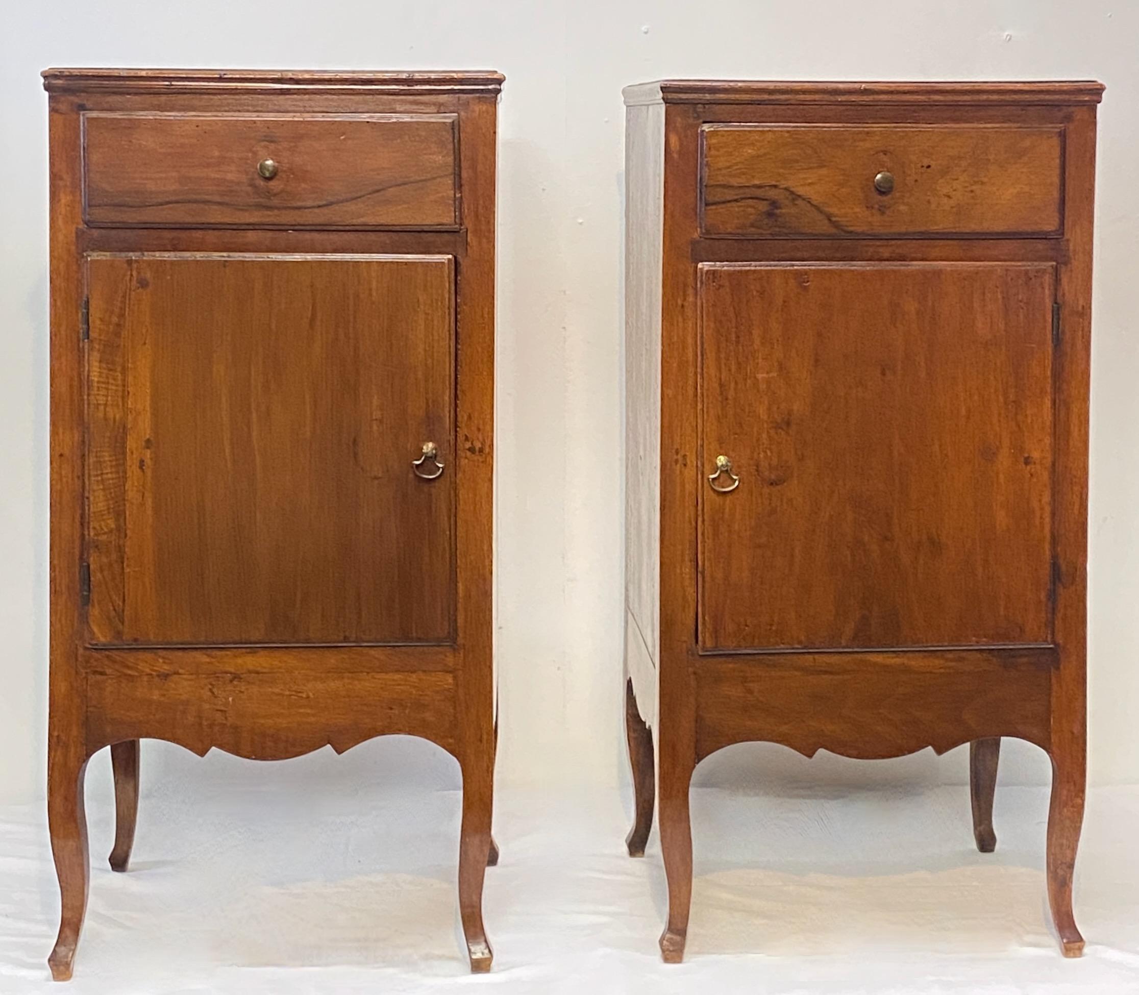 A pair of 18th century central or northern Italian walnut bedside cabinets. In remarkable antique condition, having original back boards and original hand forged rose head nails.
Beautiful very old finish possibly original.