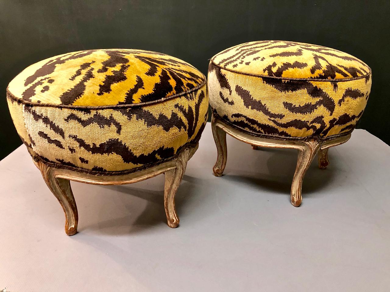 This is a charming pair of Louis XV-style footstools that are just slightly out-of-period and date to the late 18th century. The stools retain their original painted surfaces and are in overall very good structural condition. They are newly