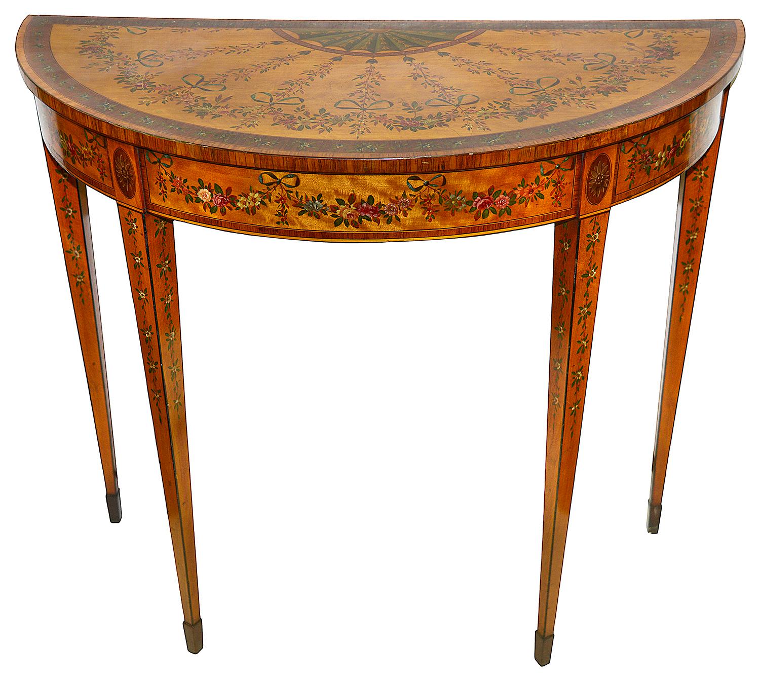 A fine quality pair of 18th Century Satinwood demi lune side tables, each with wonderful hand painted floral swag and ribbon decoration, raised on square tapering legs.