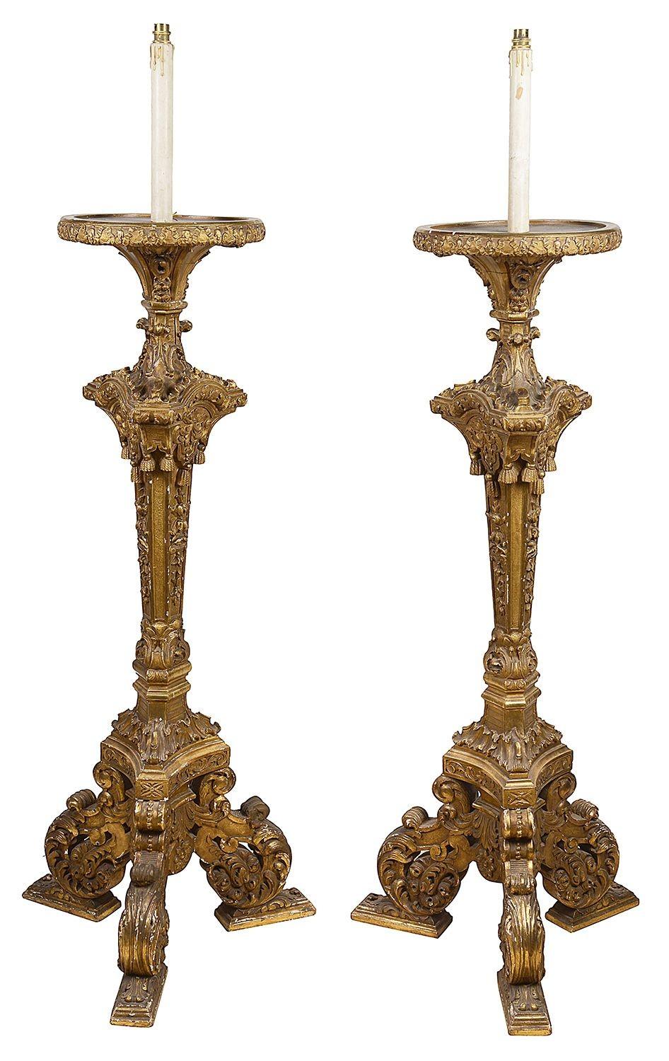 A good quality pair of 18th Century style Italian giltwood torchers / lamps.
Each with wonderful carved scrolling foliate decoration, tassels and triform bases. Circa 1880

Batch 68 DCYEK 57215