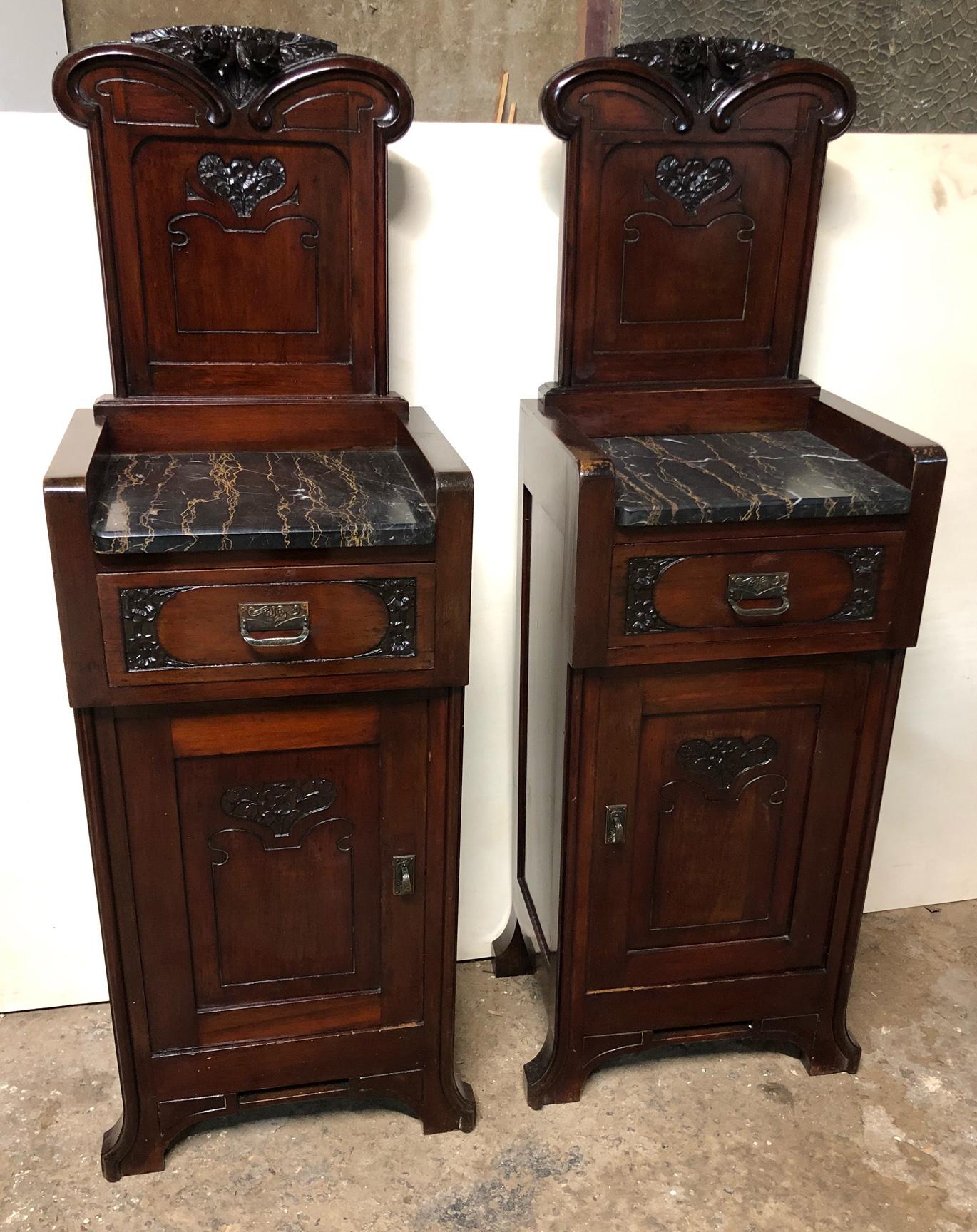 Pair of original 1900s Italian Art Nouveau nightstands in mahogany with original Portoro marble set. 
The maximum height is 130 cm. while to marble 86 cm.
They are left and right.
The nightstands are very elegant and important.
The carved parts