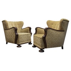 Pair 1920s Swedish Wingback Chairs With Golden Velvet And Carved Oak Armrests