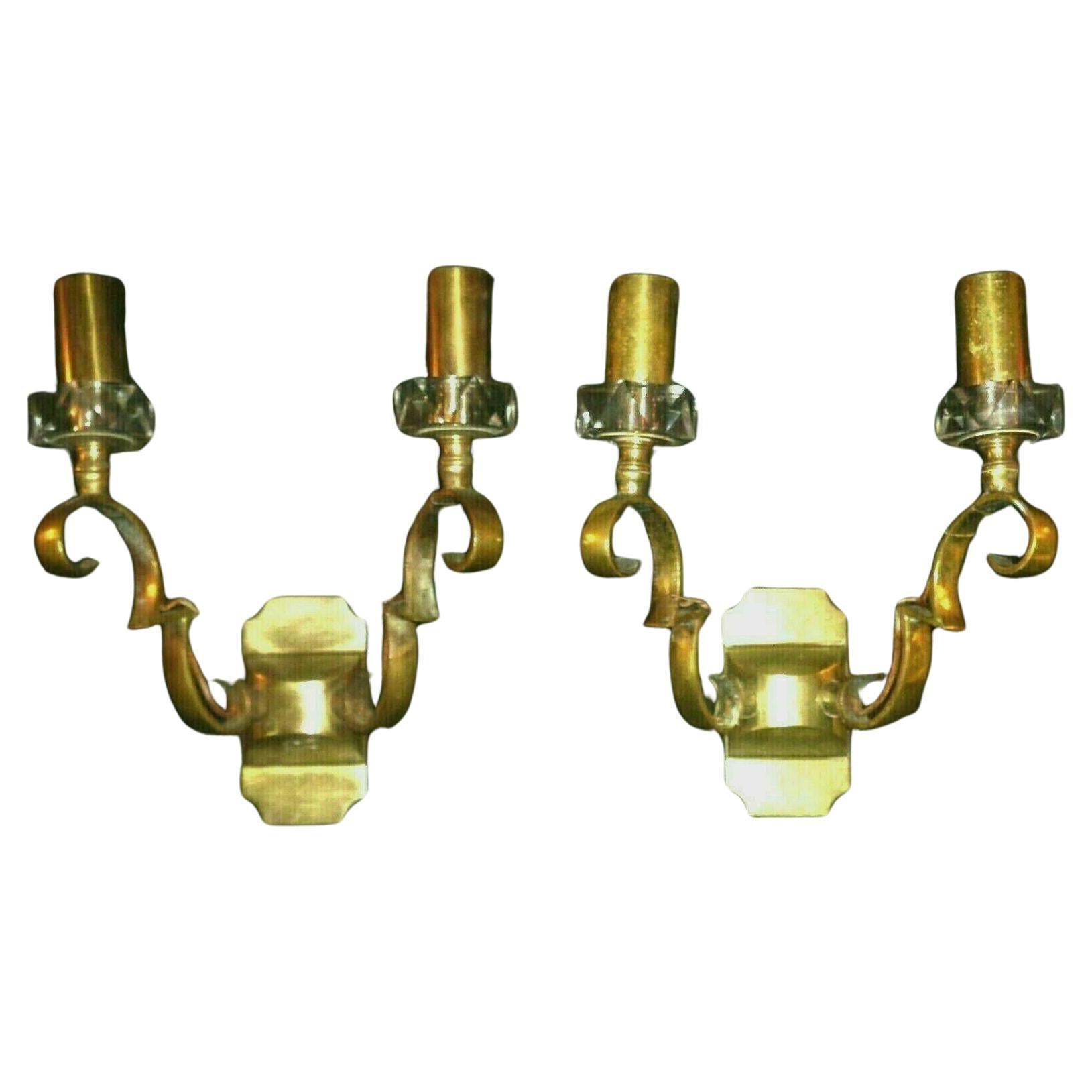 Rare Pair of French Art Deco Gilt Bronze w/ Crystal Wall Sconces Documented and made by Jules Leleu. The crystal was manufactured by Baccarat as Baccarat made the crystal for Leleu's high end lighting pieces. This exact pair is documented in the
