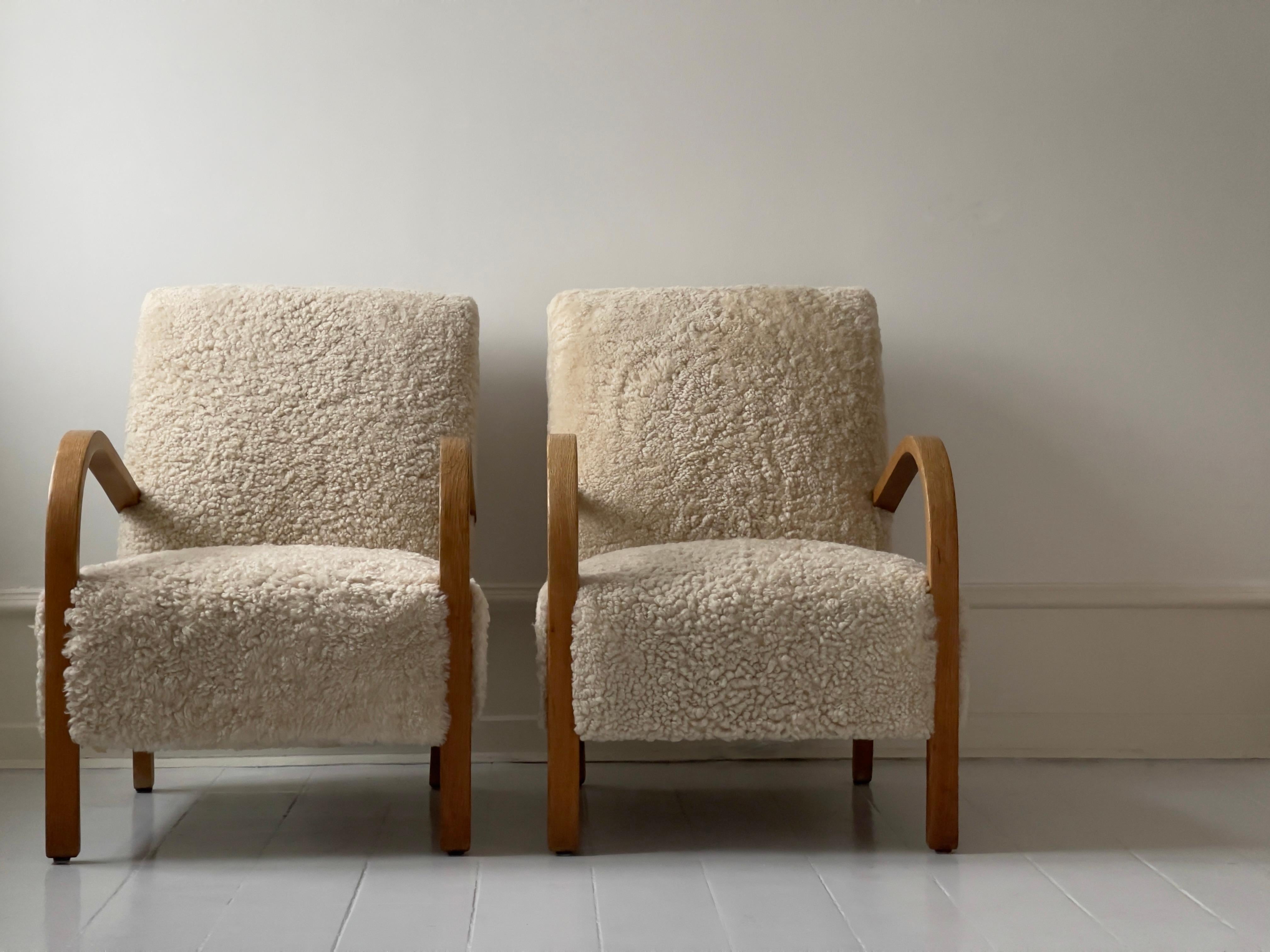 Danish Pair 1930s Fritz Hansen danish modern Lounge Chairs in Sheepskin and Oak