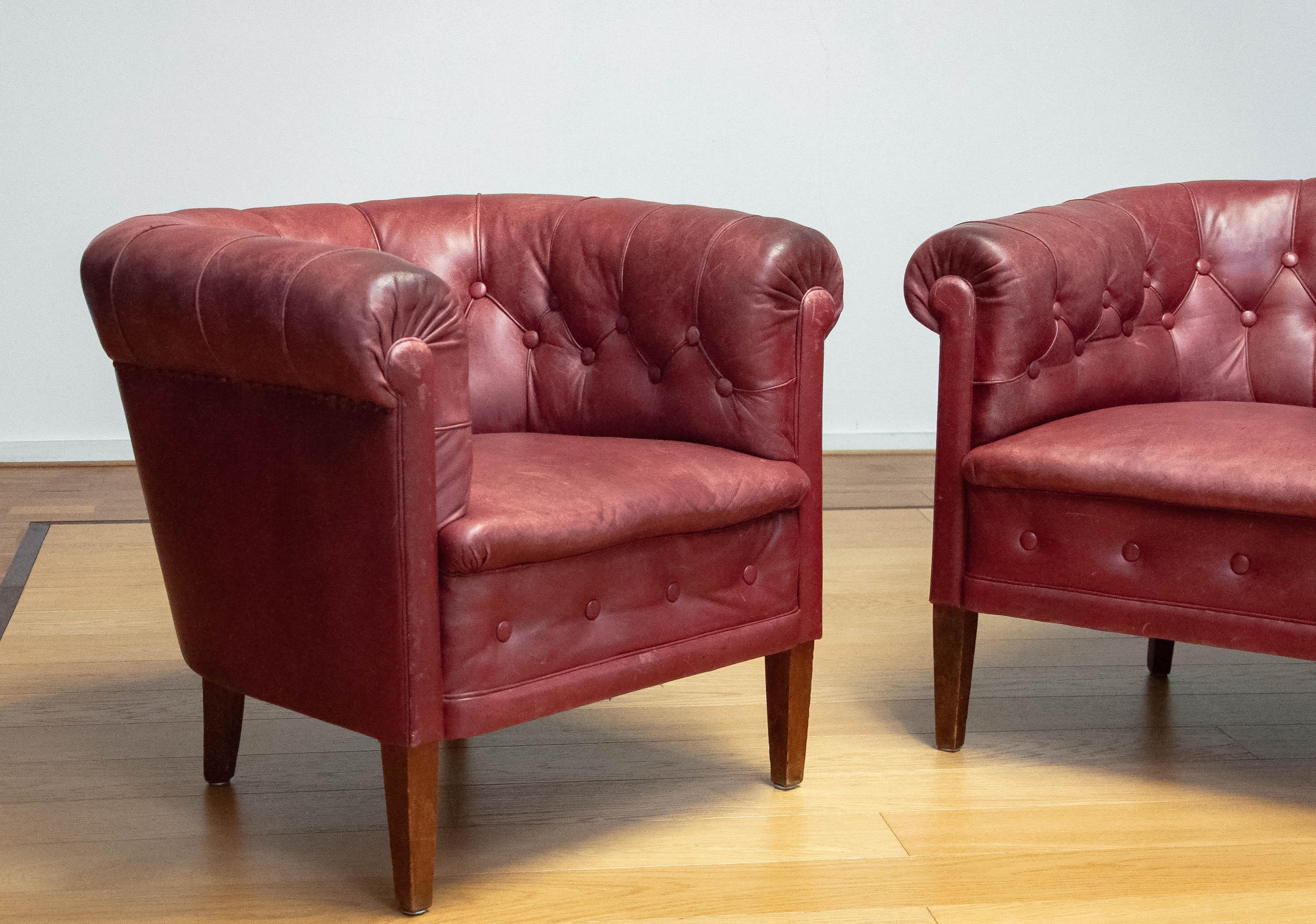Mid-20th Century Pair 1930s Swedish Crimson Red Chesterfield Club Chairs in Patinated Leather For Sale