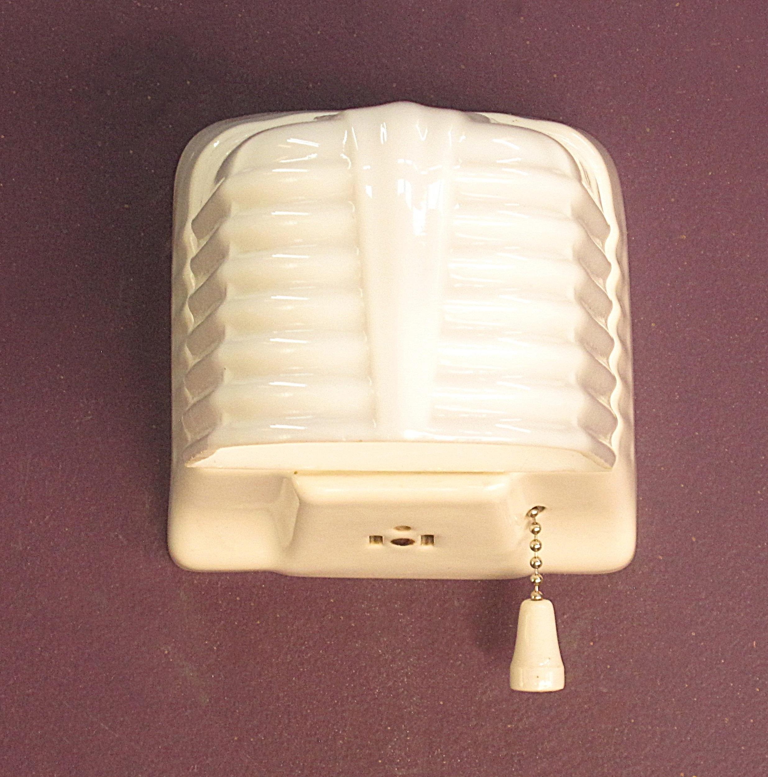 Priced for one pair with another pair also available.
The influence of the car hood designs of the early 1930s are quite noticeable in the lines of the shade, especially in the image showing the top of the shade.
These sconces are in excellent