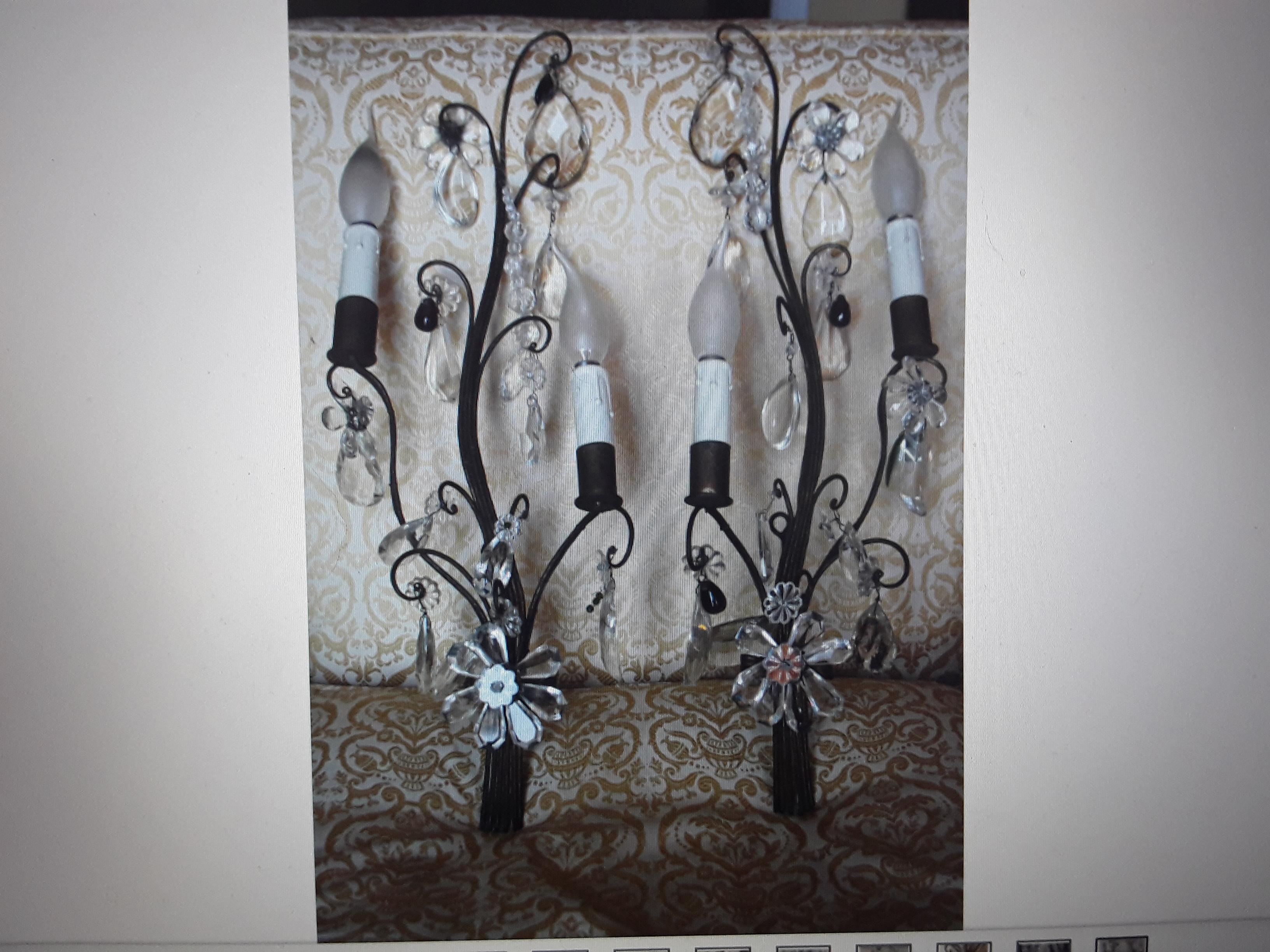 Pair French Hollywood Regency Stylized & Patinated Iron Decorated with Flowers and Cut Crystal Embellishment. Paris buying trip acquisition. These sconces are beautiful!