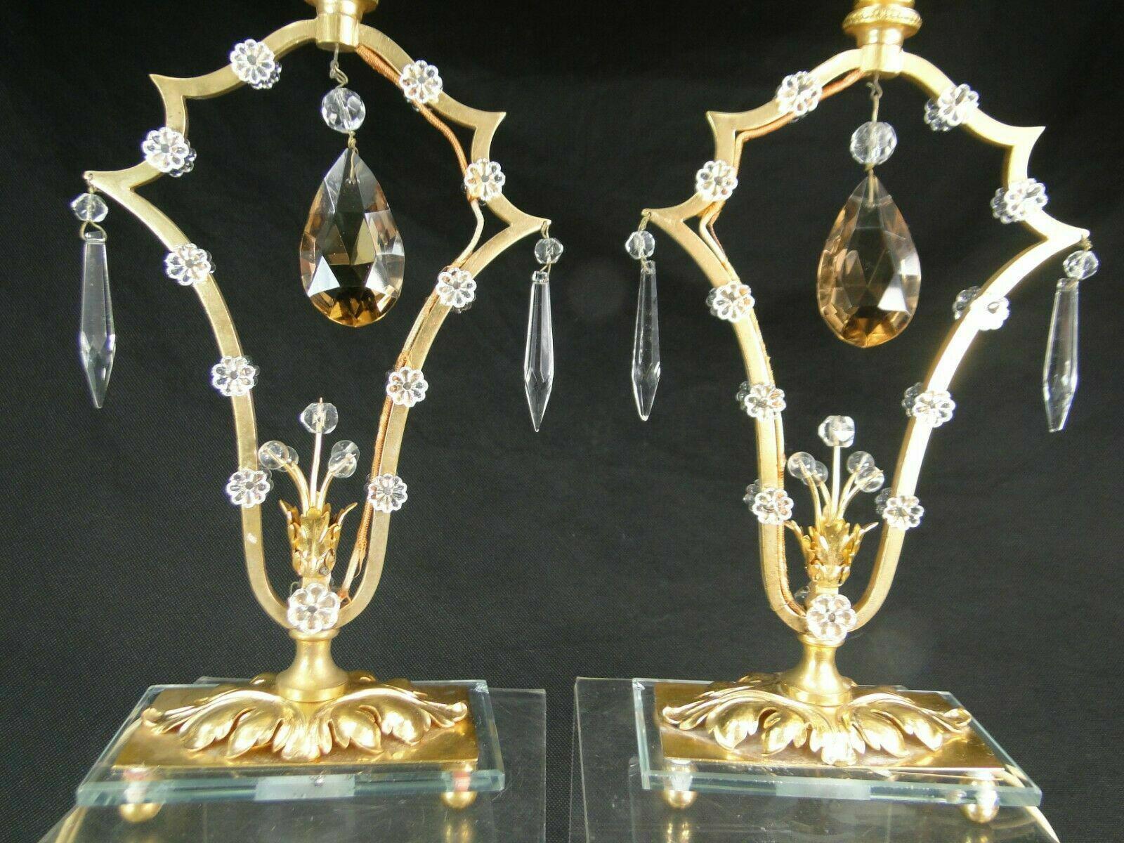Pair 1940's French Hollywood Regency Gilt Bronze and Cut Crystal Table Lamps. Gilt bronze studded with fleurettes. These are a petite size, maybe night stand use or for your perfect spot that needs a gorgeous pair of high end statement lamps.  On