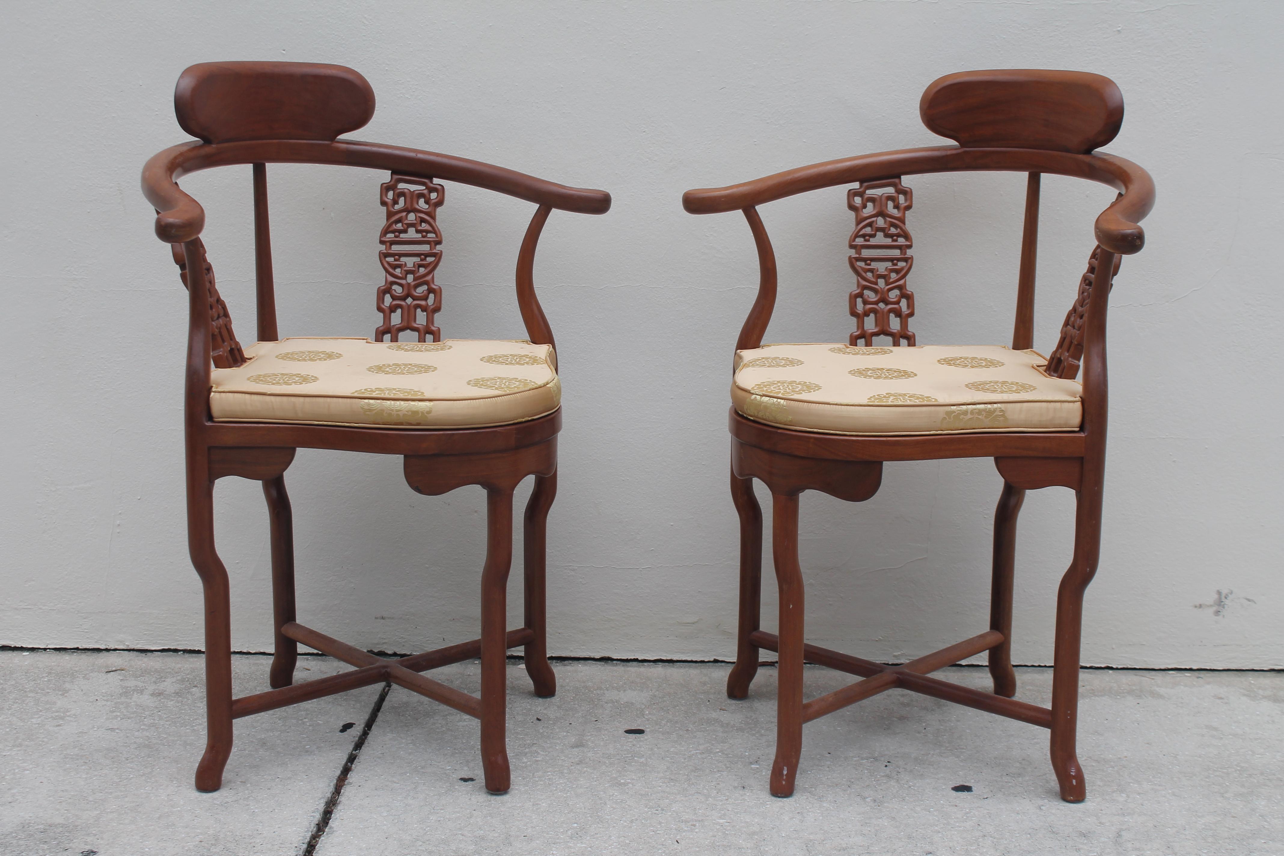 Pair 1940's Hollywood Regency Intricately Carved Japonisant/ Chinoiserie Side/ Accent/ Corner Chairs. Elegant Asian symbols carved into these chairs. Rare pair of chairs and they have cushion.
