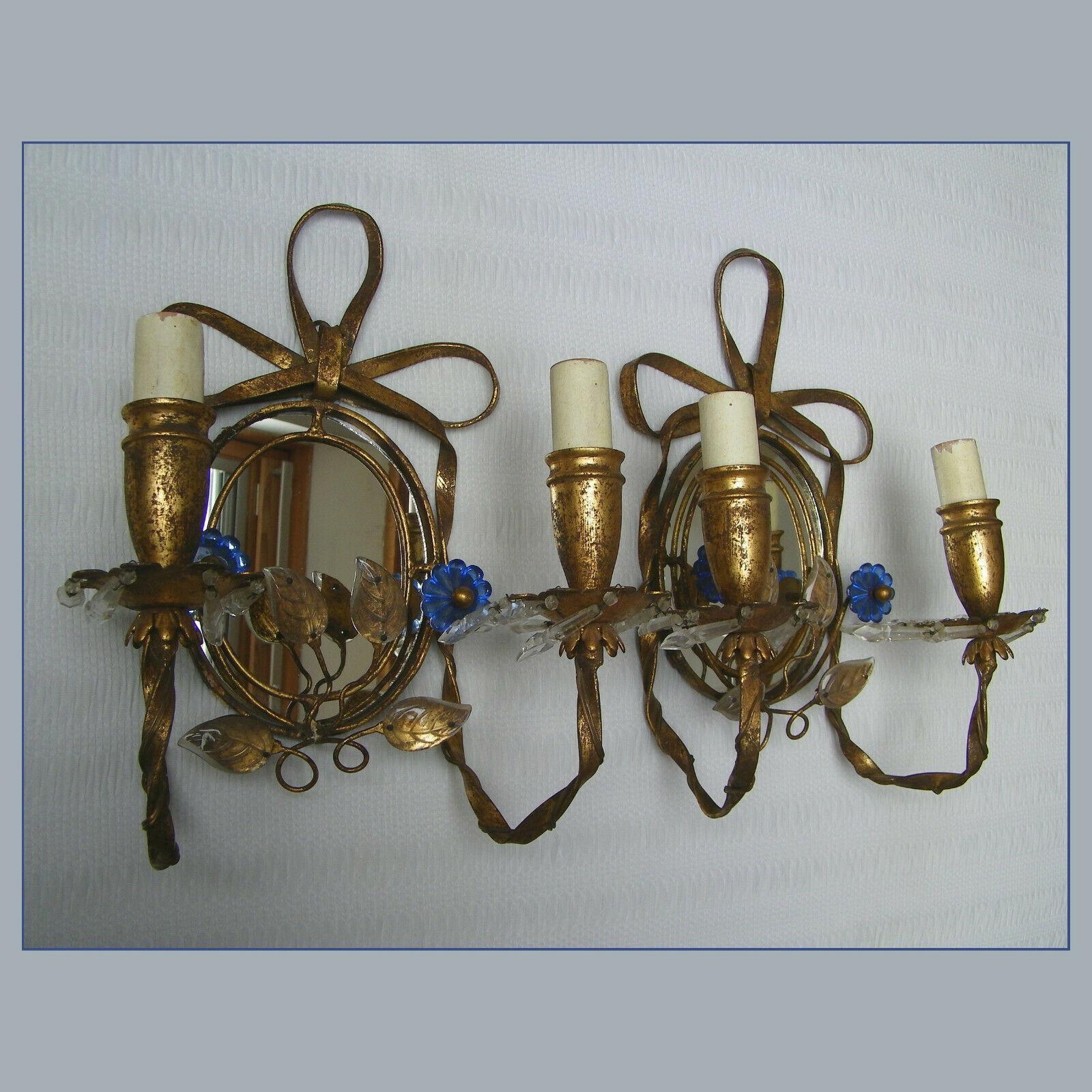 Pair Hollywood Regency Gilt Tole and Crystal Floral Wall Sconces. Tole work is beautiful, ribbon on top, reminescent of Louis XVI design. Center mirror back. Please look closely at pictures as this pair is stunning.