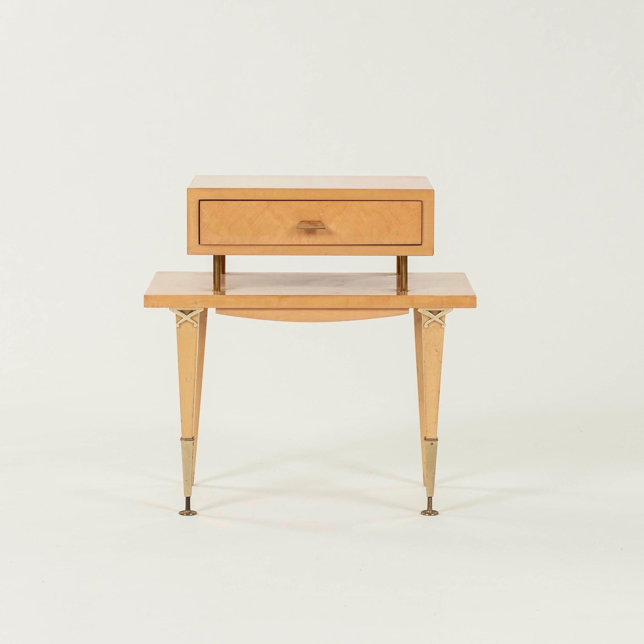 Pair of chic 1950s French lacquered maple occasional side tables with a single drawer and polished brass hardware.