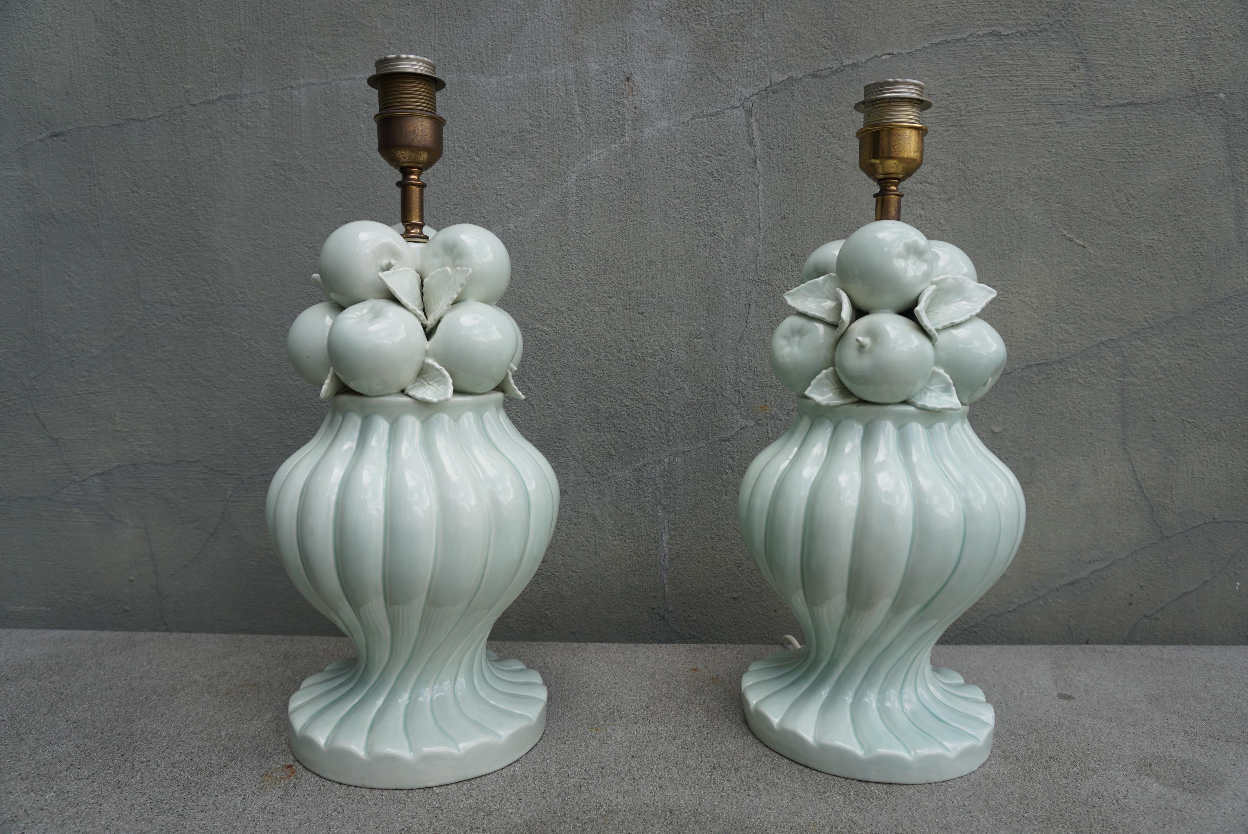 Pair of Italian ceramic fruit table lamps in mint green color by Bassanello. Nice shape and design, good condition.

Gorgeous porcelain table lamps with glossy mint green glaze!  Both signed Bassenello. (shades not included).

Measures: 8.2