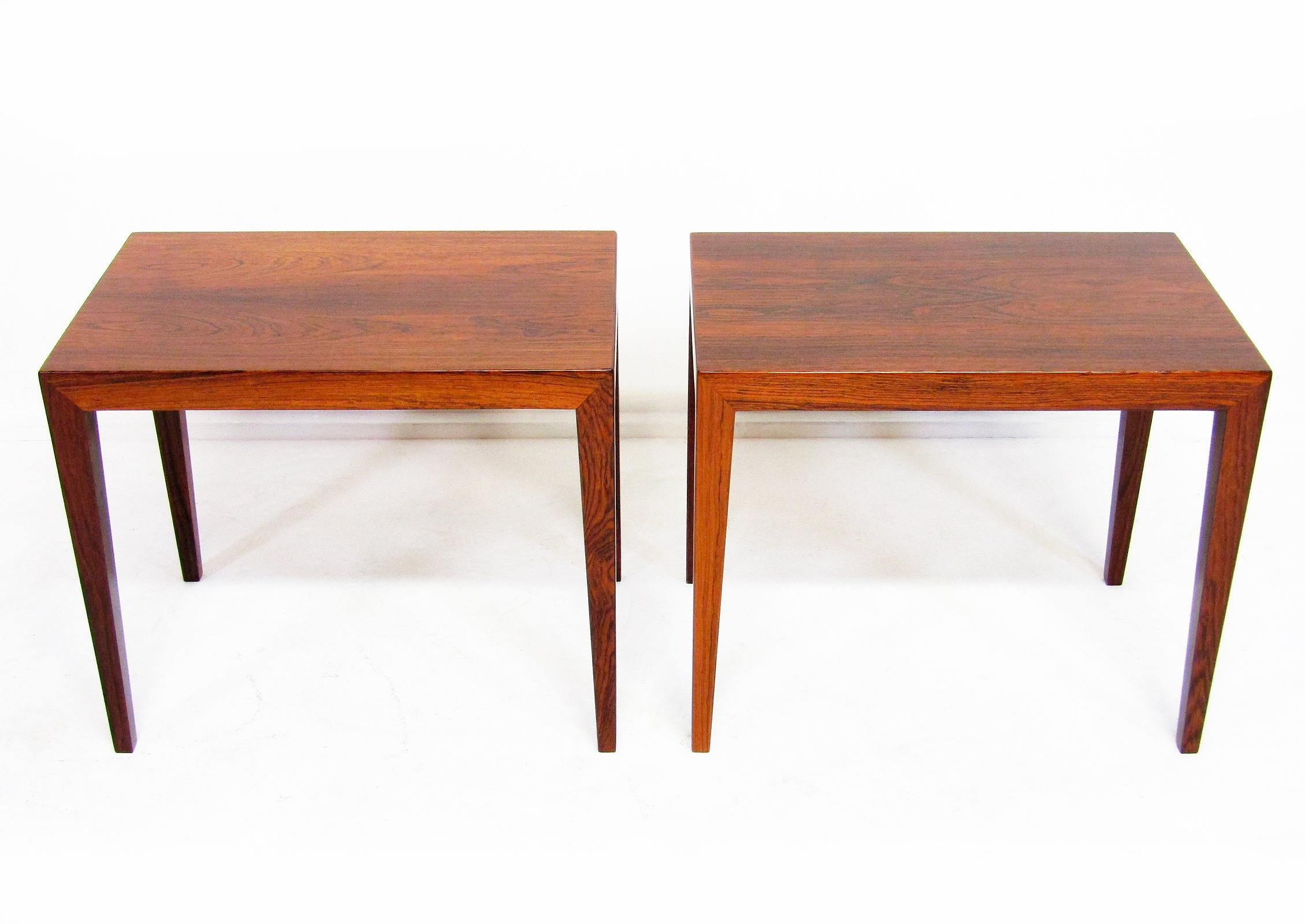 A pair of rosewood lamp tables by Severin Hansen for Danish manufacturer Haslev.

With clean lines, tapered legs and Hansen's signature mitered joints these tables are excellent for lamp or bedside use.

The craftsmanship is second to none. They are