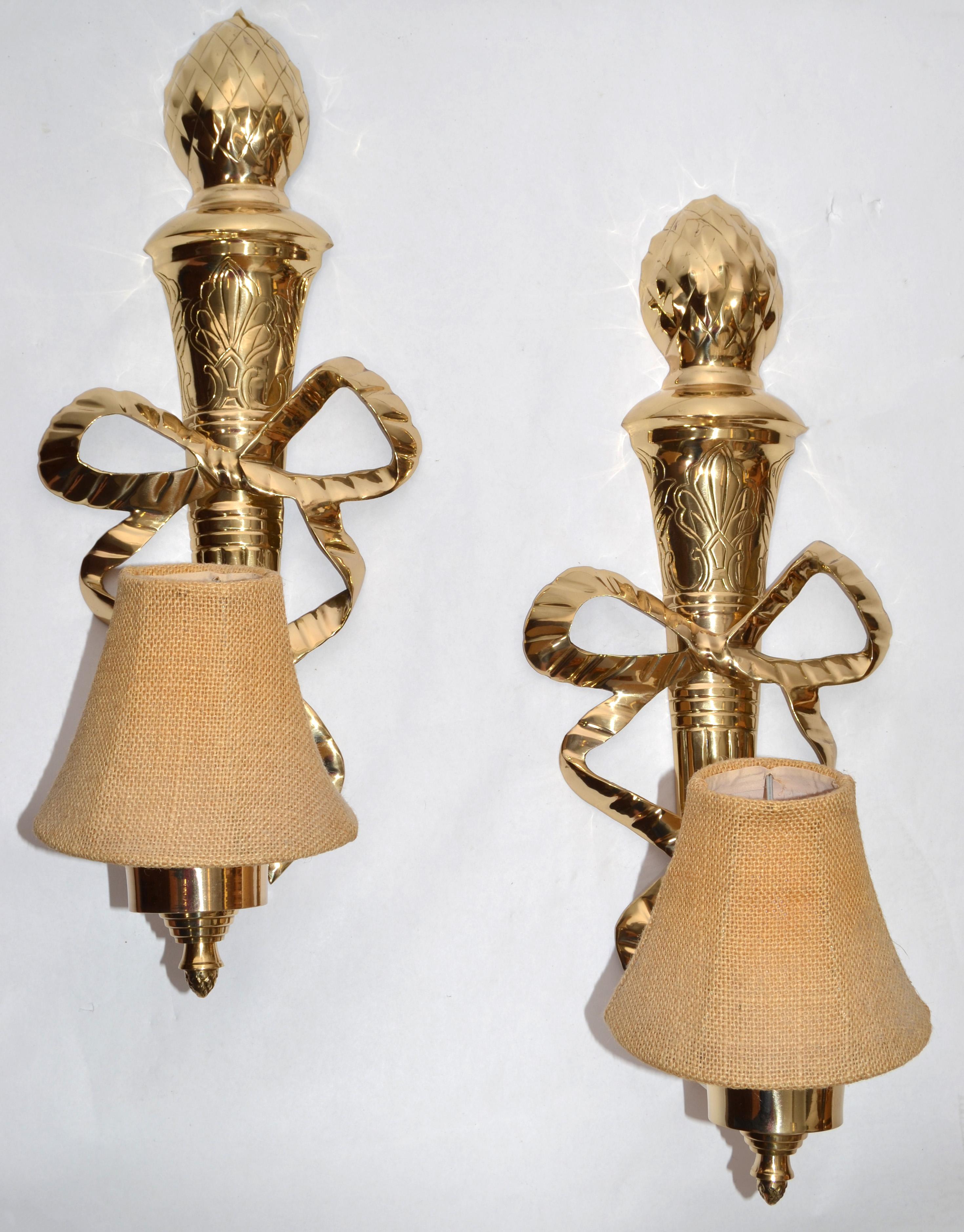 Polished Pair 1960s French Empire Style Ornate Lacquered Brass Bows Pineapple Top Sconces For Sale