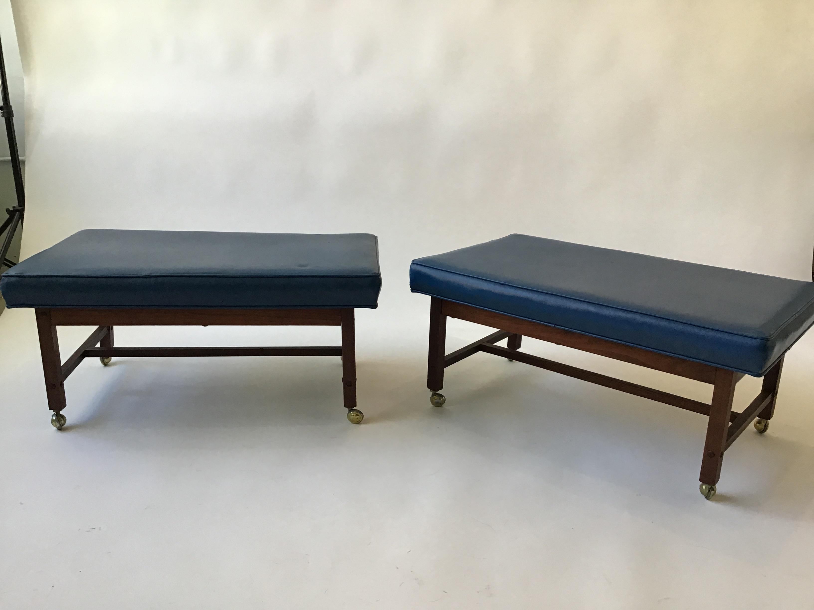 Pair of 1960s ottomans on casters.