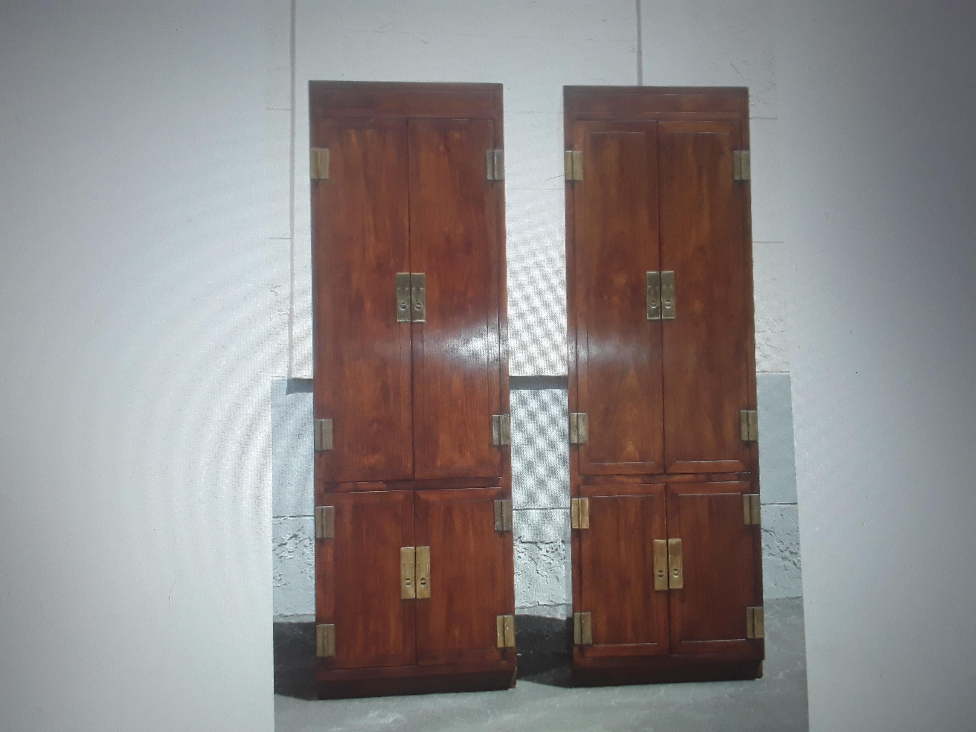 Rare Pair of Vintage 1960's Tall and Slim Campaign style Wardrobes/ Armoires/ Cabinets. The hardware is stunning. These would work anywhere but tight spaces? perfect!