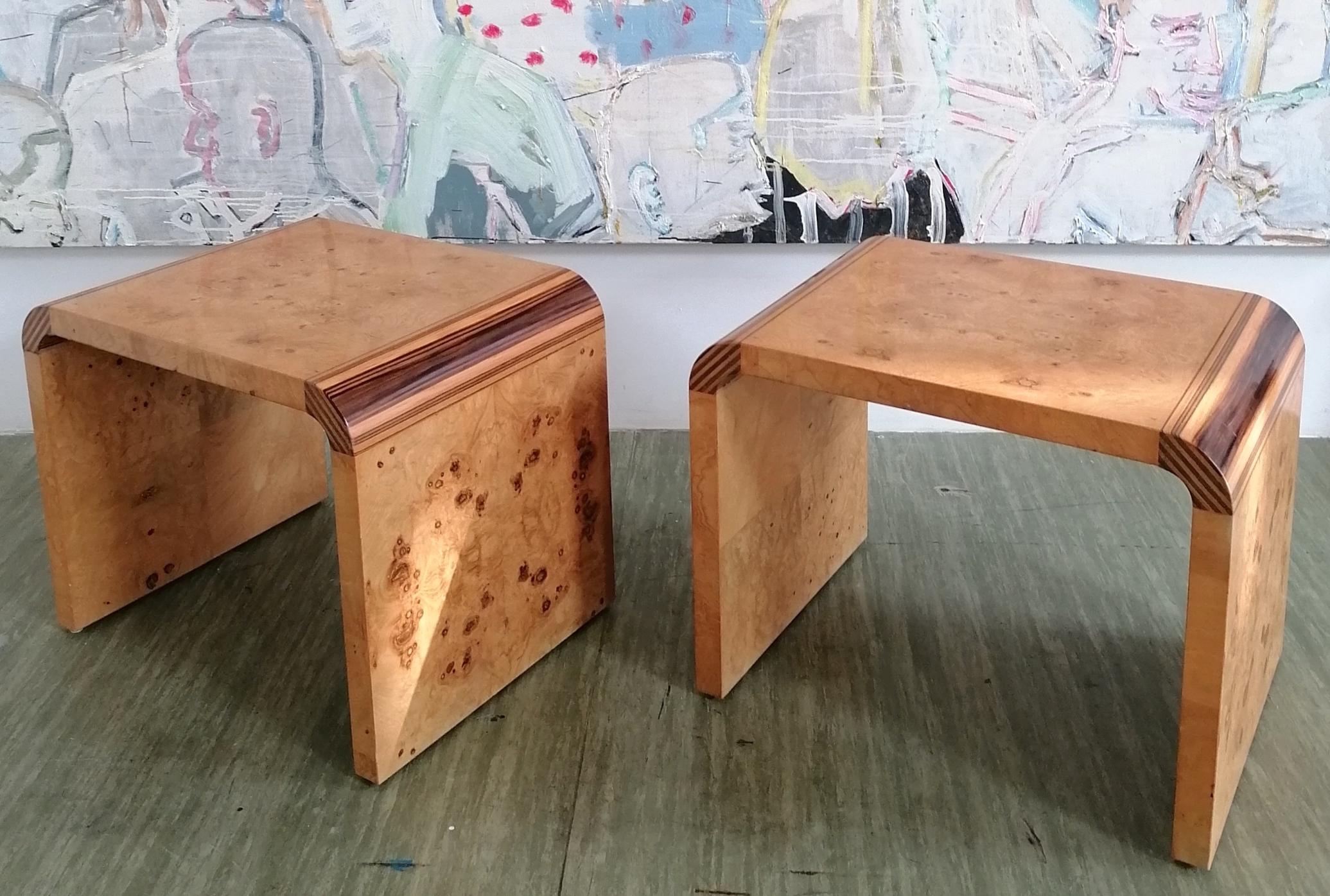 A rare pair of 1970s American waterfall side tables, from Henredon Furniture's high-end 'Scene Two' range. Book-matched burr olive wood, with unusual striped macassar ebony inlaid corners.
Would also work well as bedside tables, or stools (they're