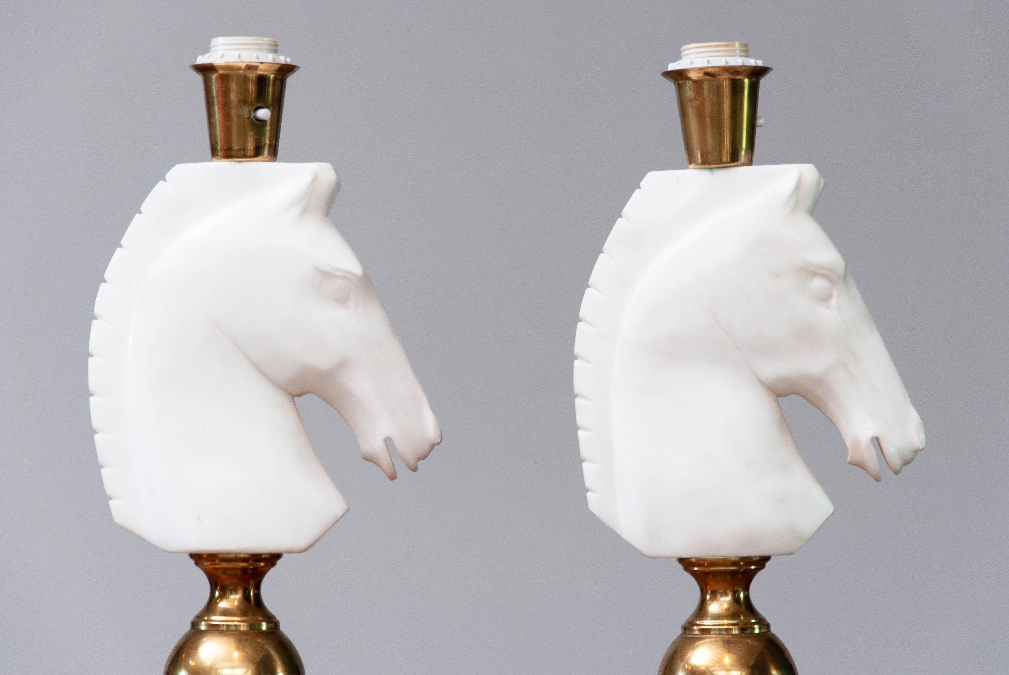 Beautiful and absolutely rare set of two matching table lamps in brass and beautiful hand cut Italian alabaster horse heads. These two masterpieces combined with great shades wil absolutely create a fabulous ambiance into your house.
Technically