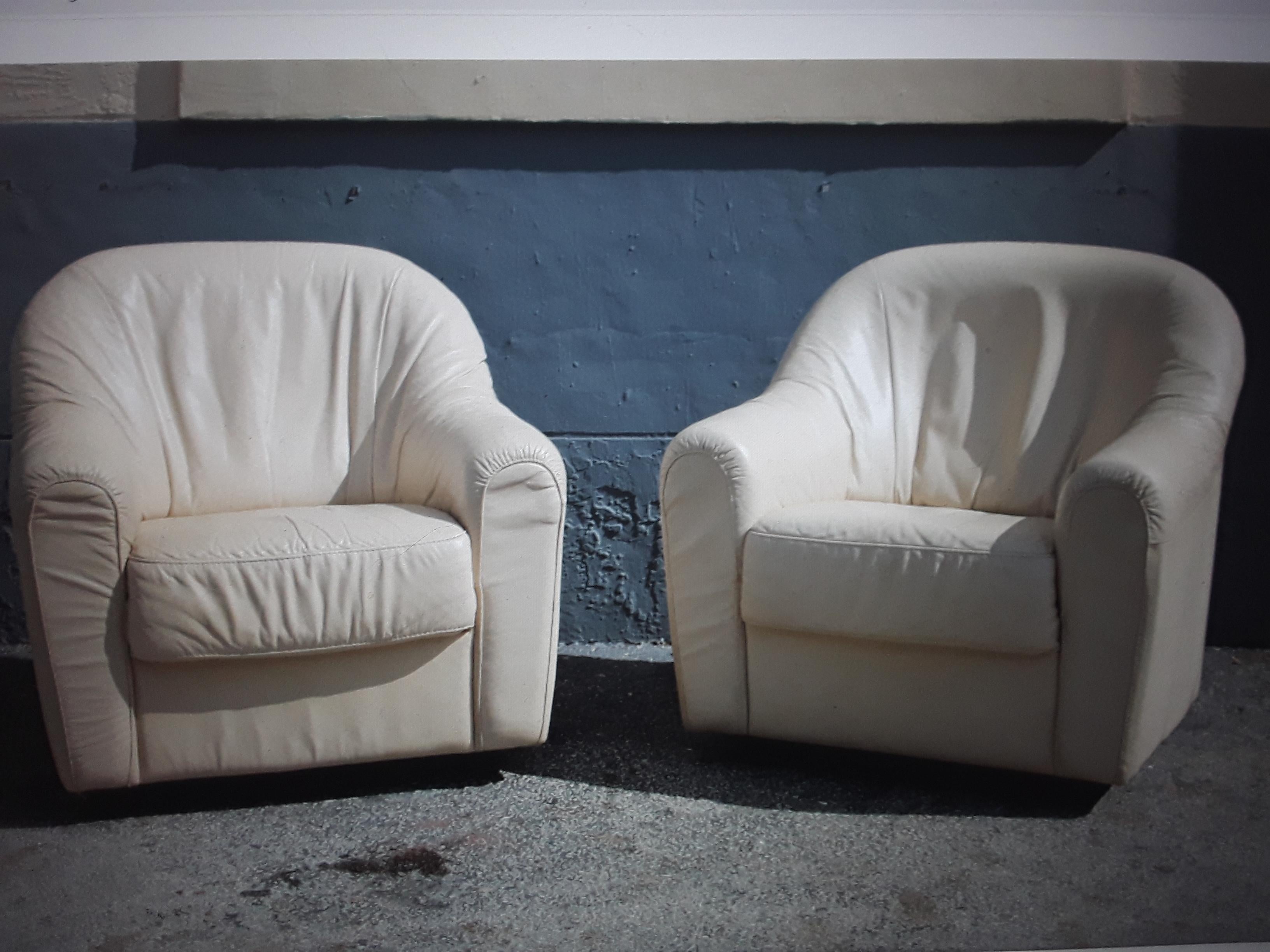 Pair Mid Century Modern Cream Toned Leather Swivel Club Chairs. These chairs are very comfortable!
