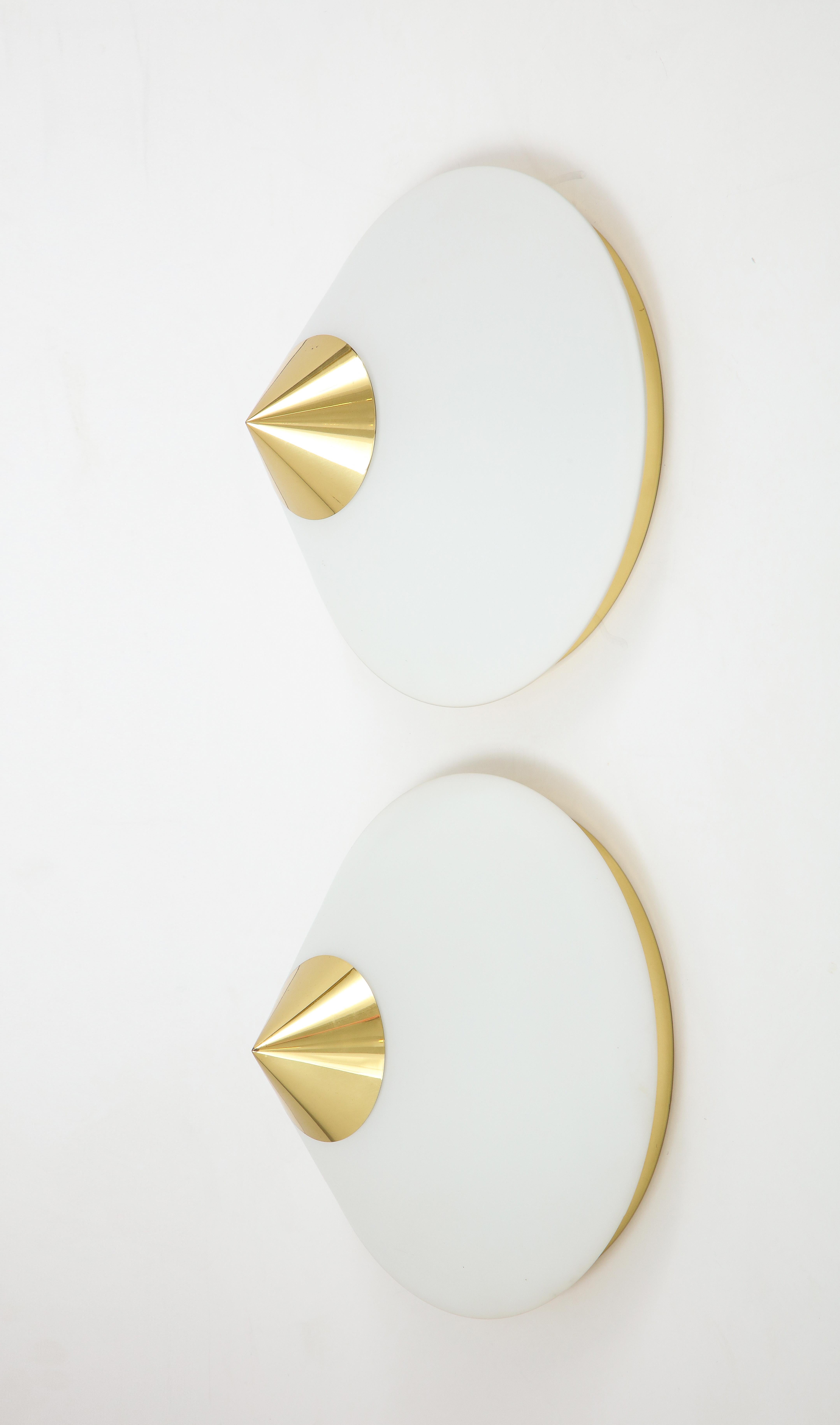 Pair of 1970s midcentury flush mount / sconce by Limburg.
The large cone shaped opaline glass shade finished with a polished brass cap sits on a
wall plate that has been newly rewired for the US with a single light source Max 60 watts.
They are