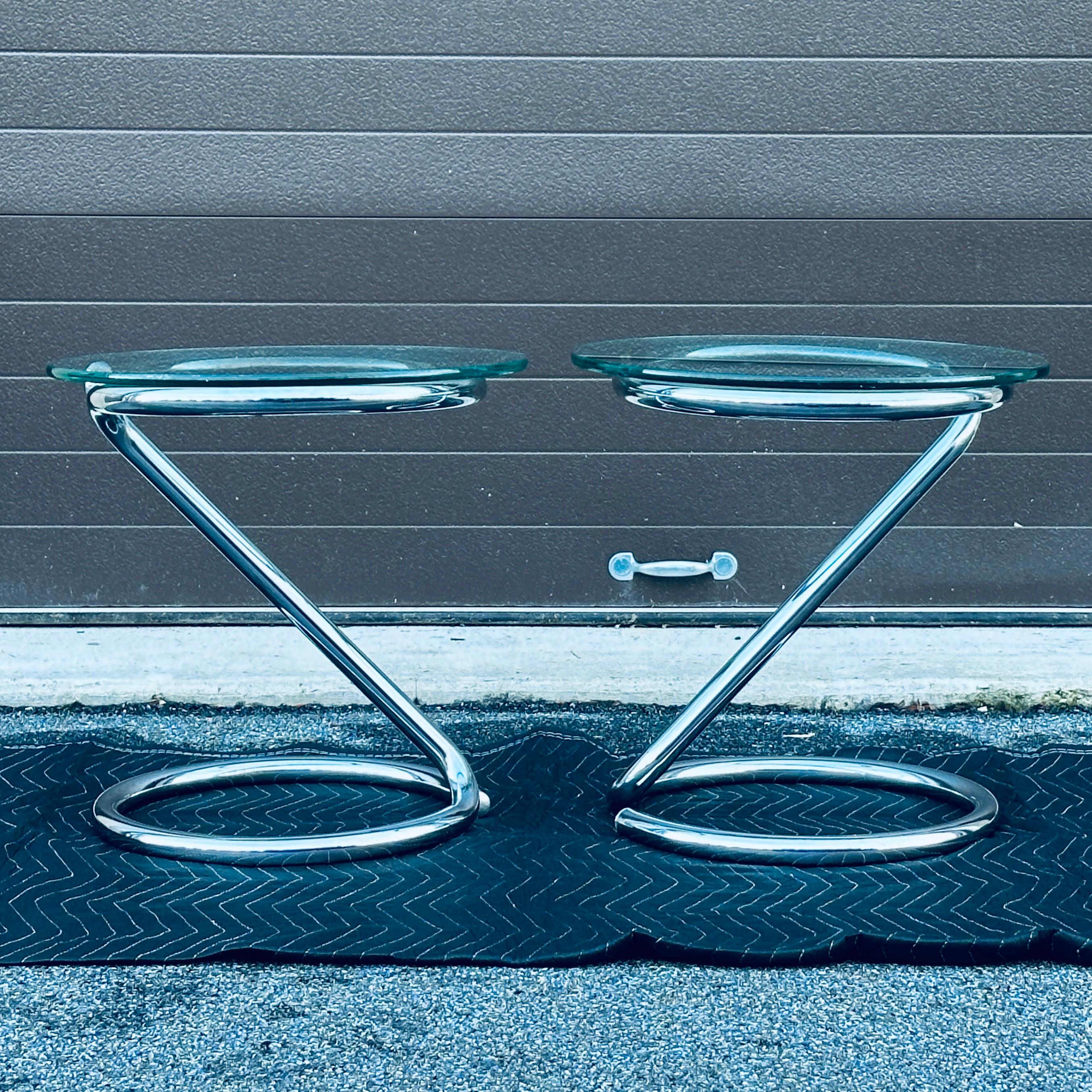 Pair of vintage anaconda style tubular chrome round side tables in the manner of Paul Tuttle. Circa 1960's/1970's unmarked.