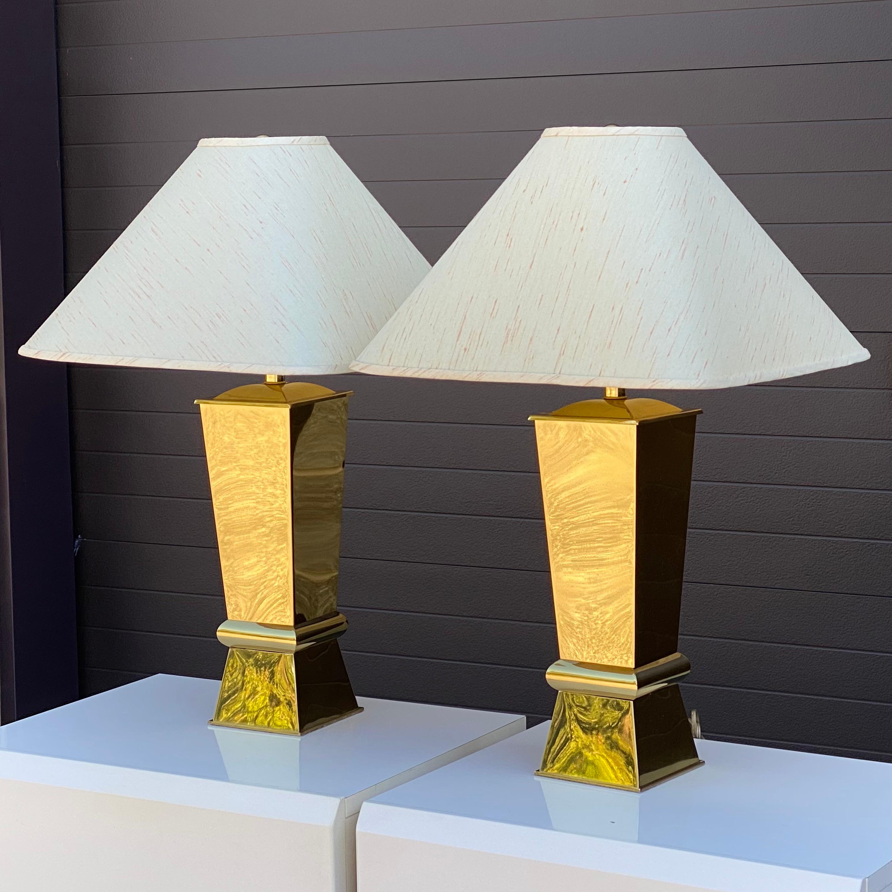Pair of 1980's sculptural brass lamps with original white and pink shades and brass ball finials.

Shade measurements:
18.75” x 18.75” x 11”h 
Lamp measurements:
6