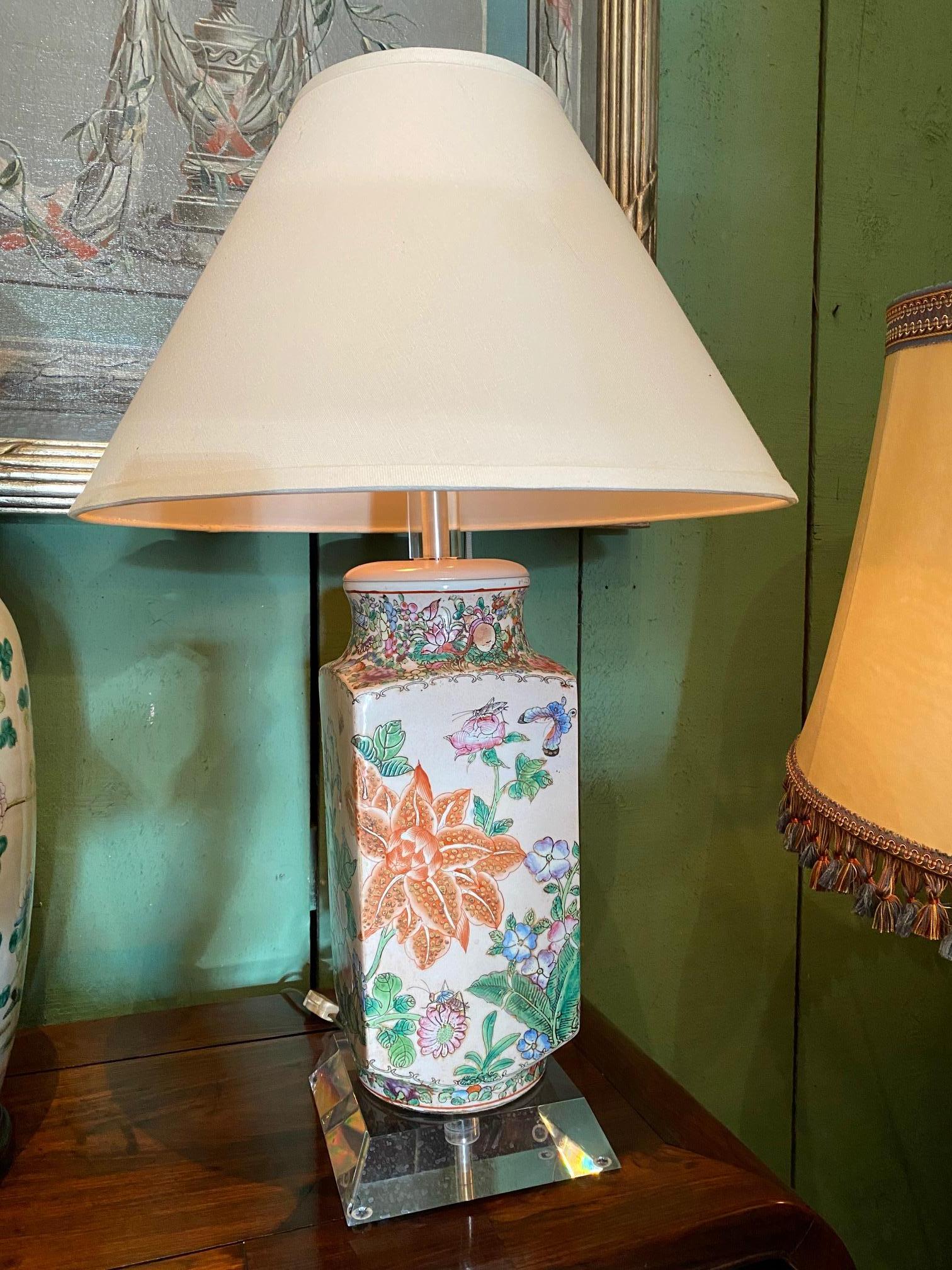 Pair of beautiful 19th century chinoiserie oriental vases with plexiglass mounts wired as lamps With Simple Old handmade shades. Square vases Decorated with an array of symbolic flowers in blue and white, pink and orange. The flowers rises from the