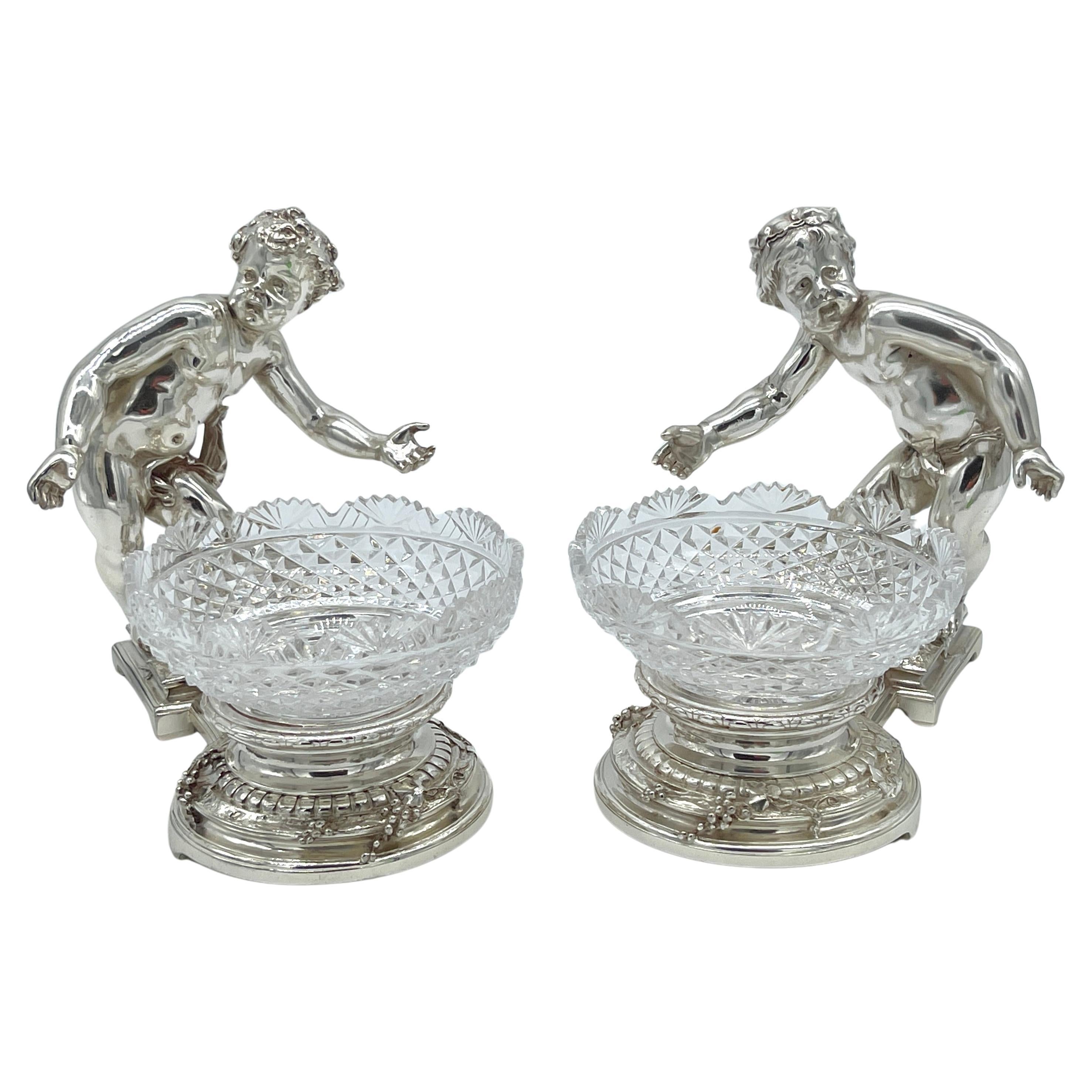 Pair 19th C. Christofle Silvered Bronze Putti and Crystal Centerpieces
France, circa 1875

Highlighting the extraordinary skill of Christofle’s makers, this exquisite pair of 19th-century Christofle silvered bronze putti and crystal centerpieces