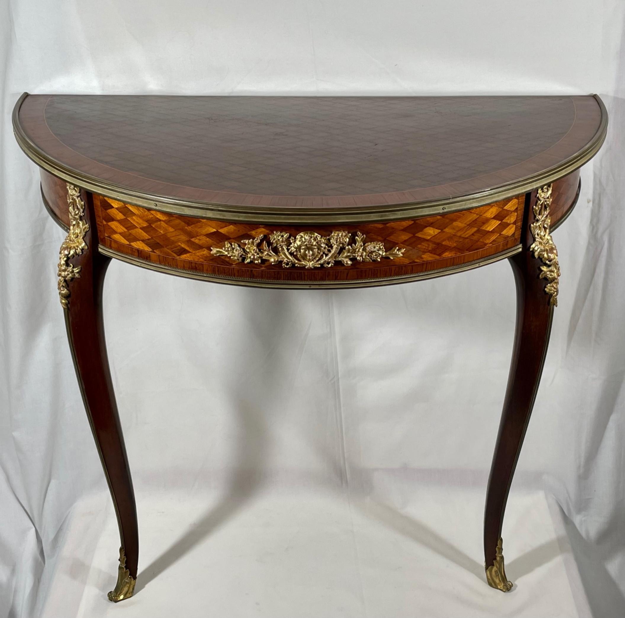 Pair of French 19th C. Francoise Linke Louis XV style ormolu mounted mahogany
Demi-lune Consoles. 

An elegant pair of French 19th century Louis XV style ormolu mounted and parquetry inlaid demi-lune consoles by Francois Linke (1855-1946). Raised
