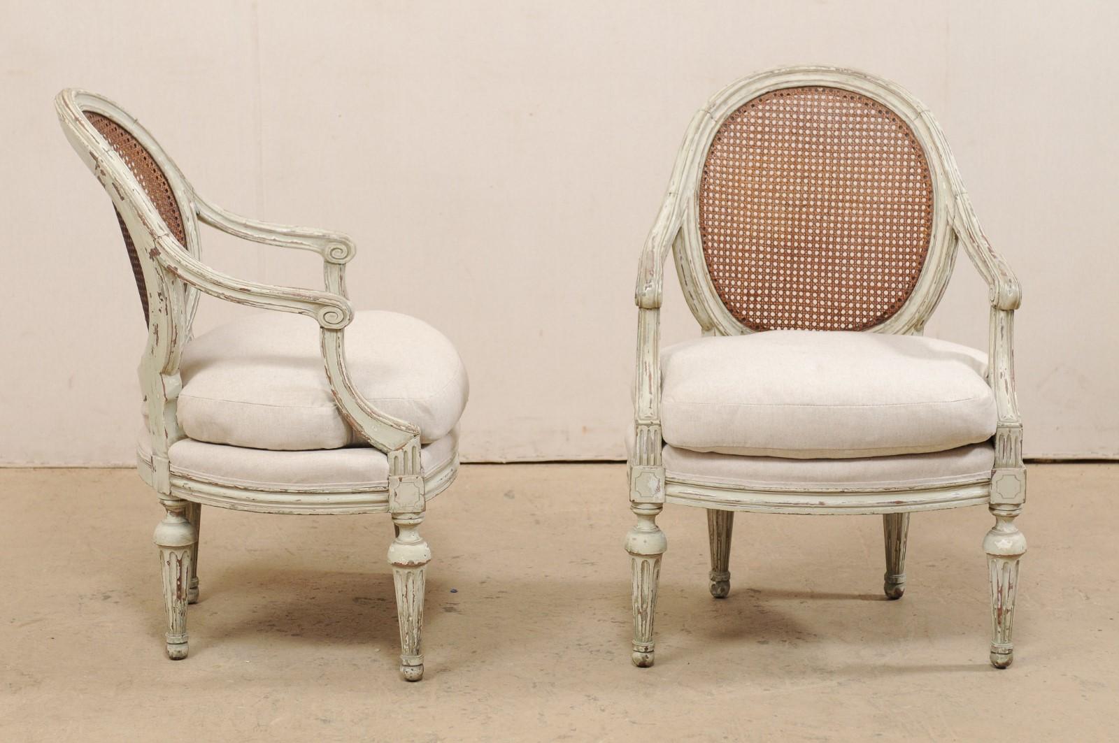 Wood Pair of French Louis XVI Style Armchairs with Caned Backs and Upholstered Seats