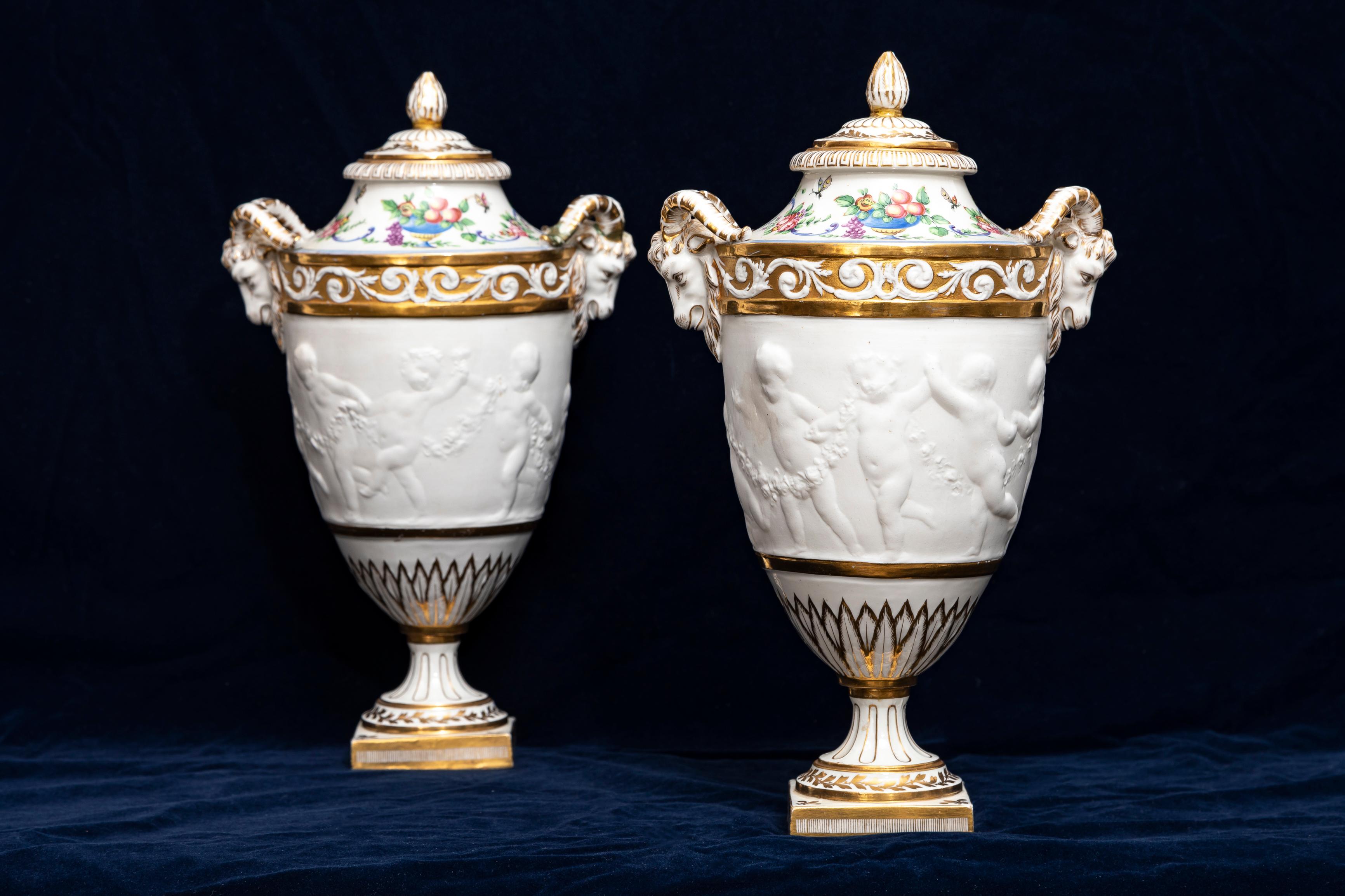 Louis XVI Pair 19th C. French Sevres Biscuit Porcelain Lidded Vases w/ Rams Head and Putti