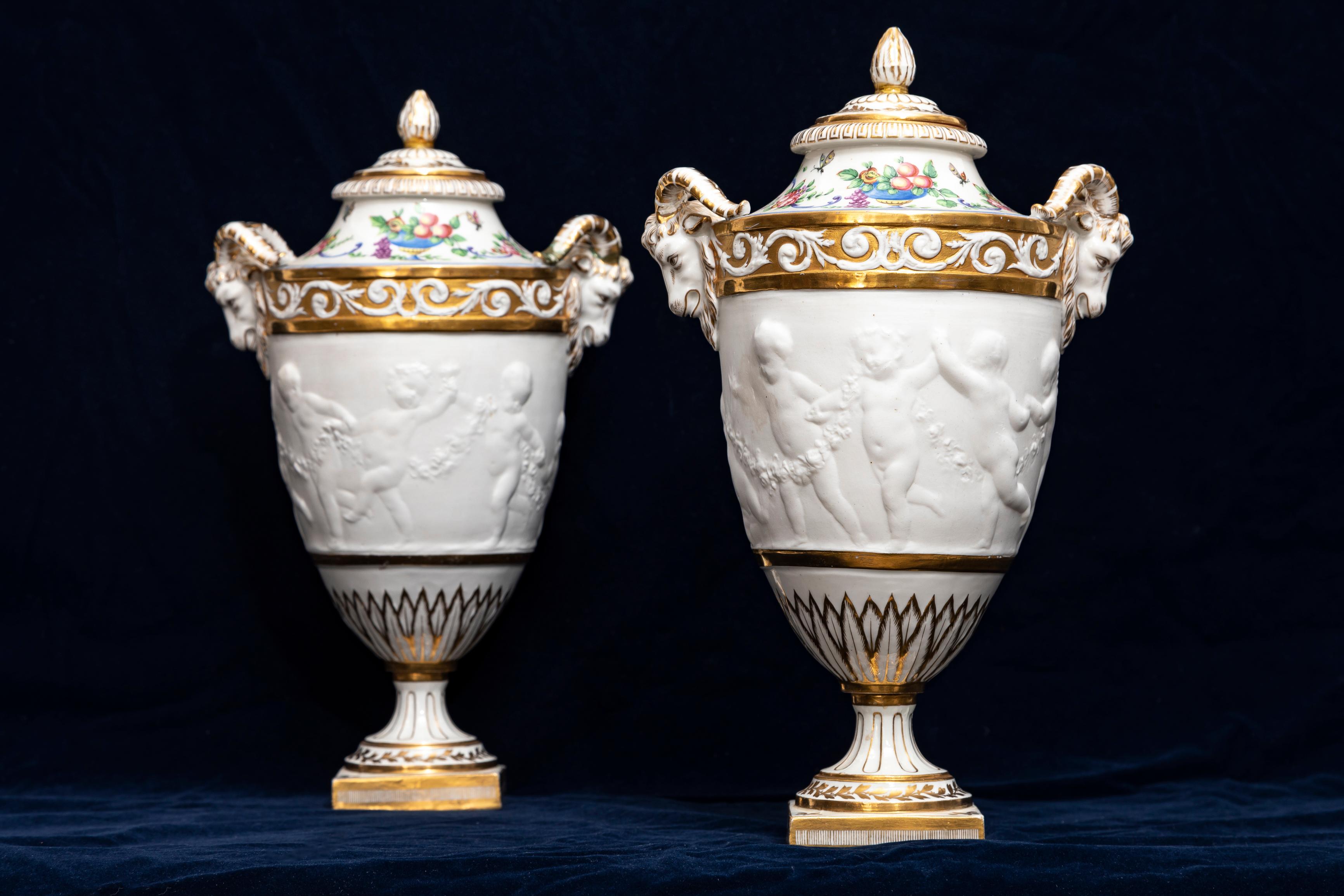 Hand-Carved Pair 19th C. French Sevres Biscuit Porcelain Lidded Vases w/ Rams Head and Putti
