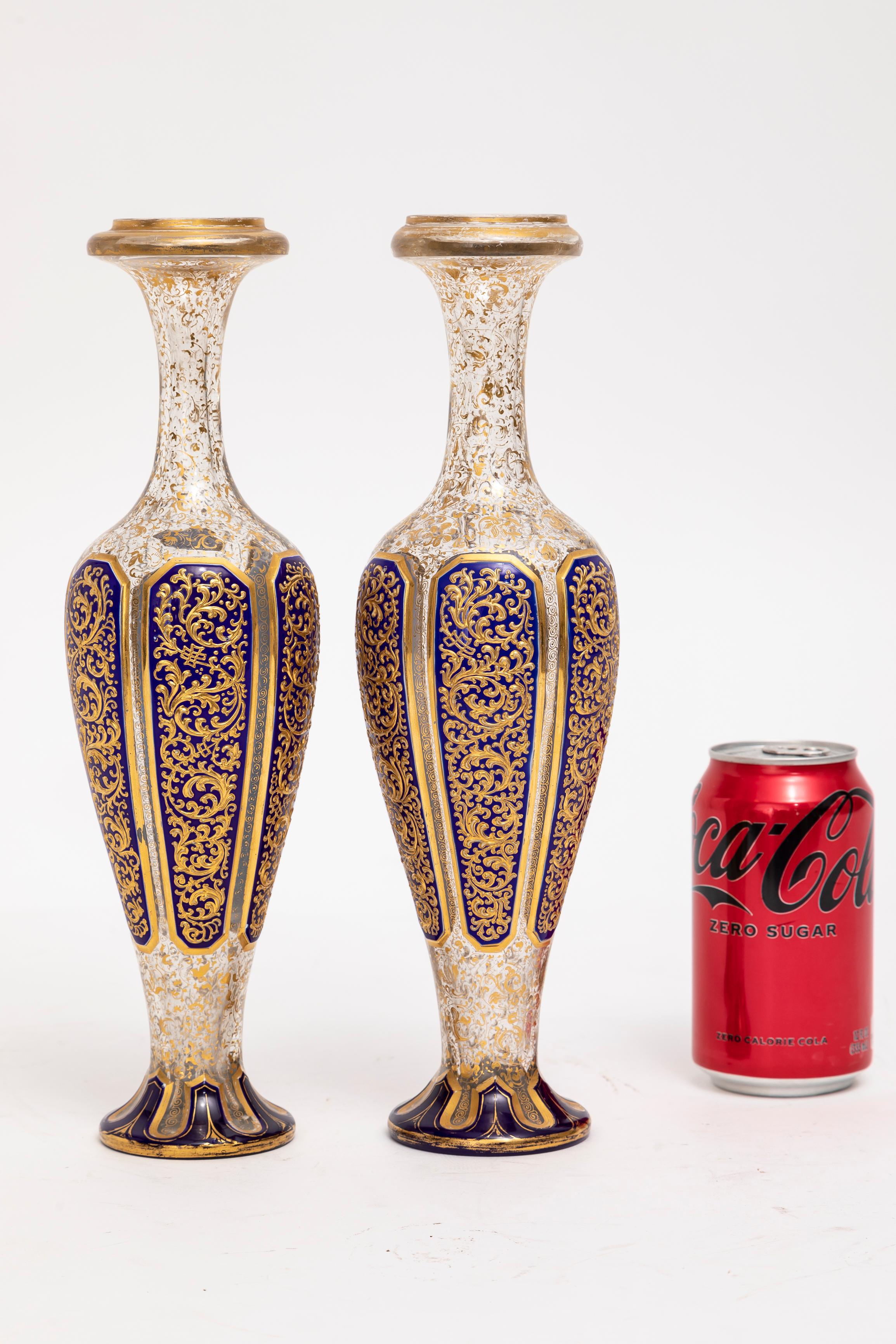 A Pair of 19th Century Moser Islamic motif Double Overlay Cobalt Blue Cut-to-Clear Gold Floral Decorated Vases.  This pair of gorgeous crystal vases, adorned with intricate gold floral decorations in the Islamic taste, showcases the pinnacle of