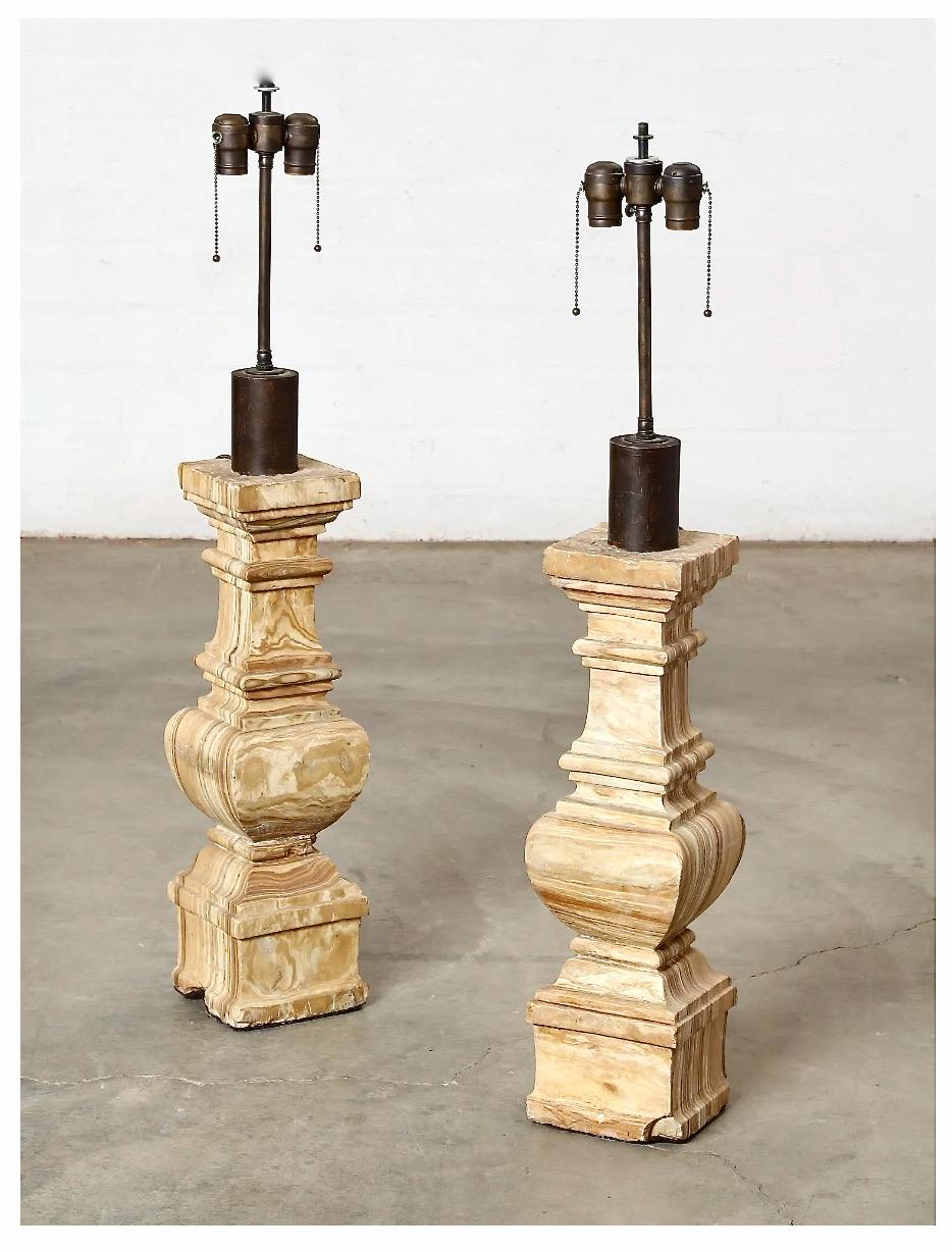 This is an impressive pair of 18th/19th century Italian alabaster balusters that have been adapted to lamps with a French wire electrical fitting. The alabaster balusters are in very good patinated condition. We do not consider the chips at the base