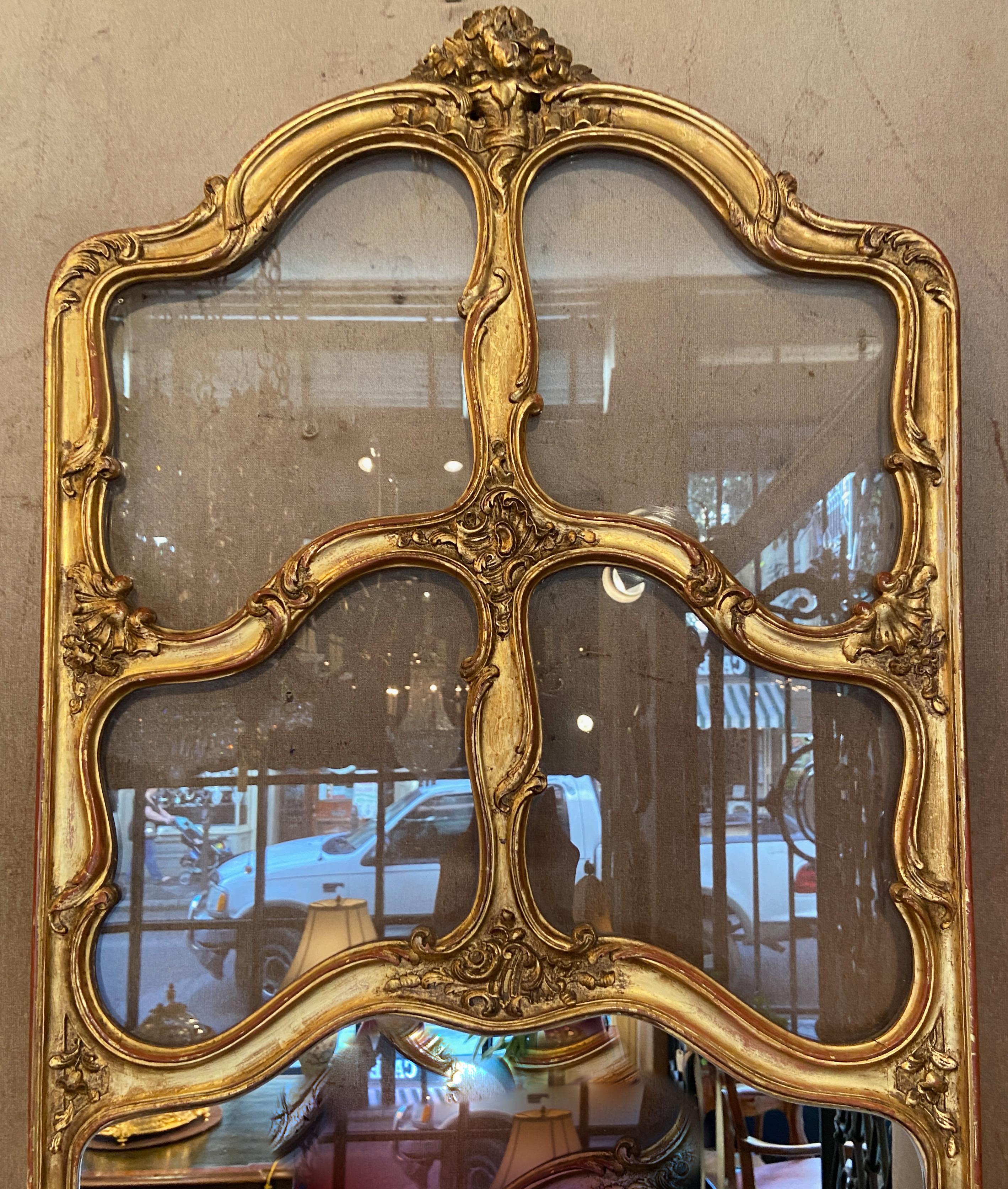 Pair 19th century antique French carved gold-leaf mirrors. Beautifully styled mirrors with 4 clear glass panels in curved molding at the top with mirrors underneath.