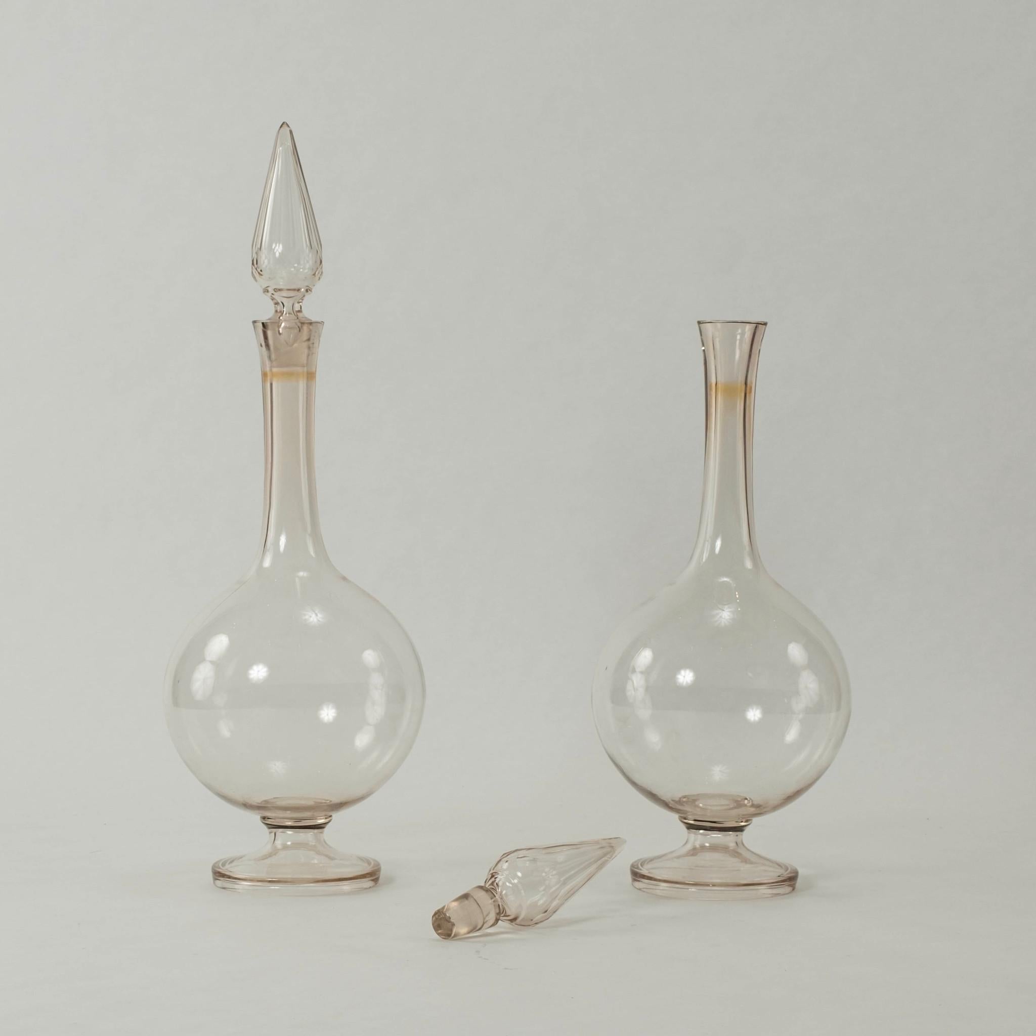 An outstanding and extremly rare pair of hand blown 19th Century pharmacy carboys with cut crystal stoppers.