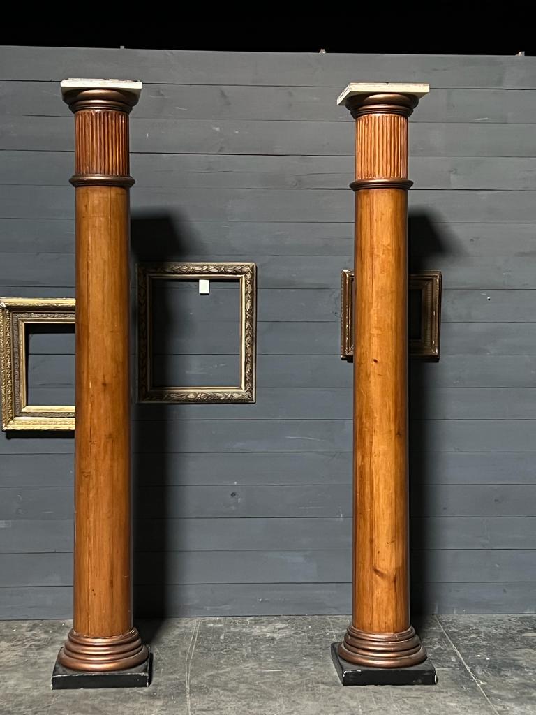 A superb pair of 19th century Architectural Columns. Made from pine having fluted tops and the very top cap can removed if preferred (see photo). They came from France and have a great decorative look and feel. One has a slight split that could be