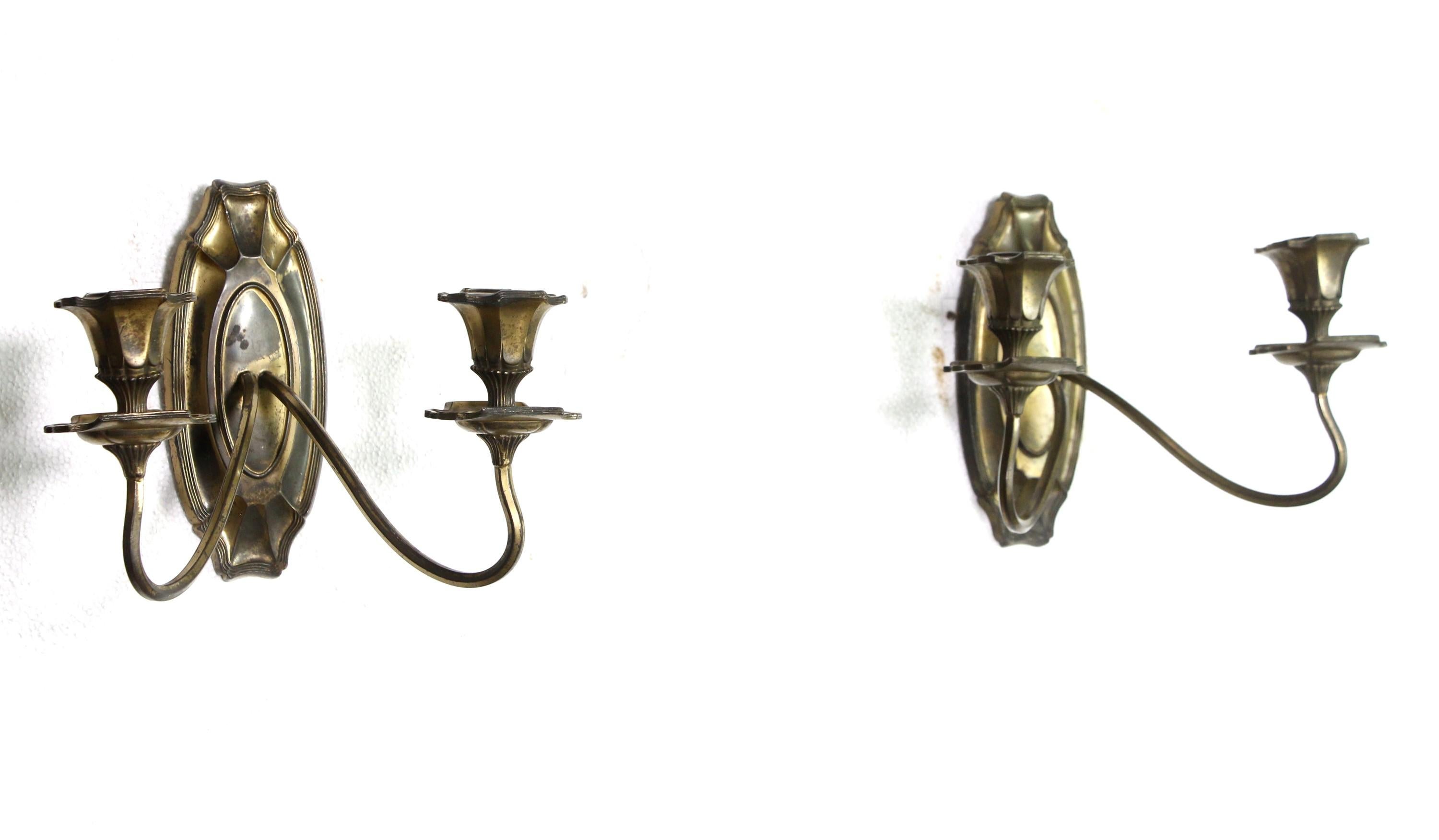 American made two arm sconces fashioned out of silvered bronze and presented in an Art Nouveau style from the late 19th century. Priced as is with light cleaning. If you would like this electrified, please email for a quote. Priced as a pair. Please
