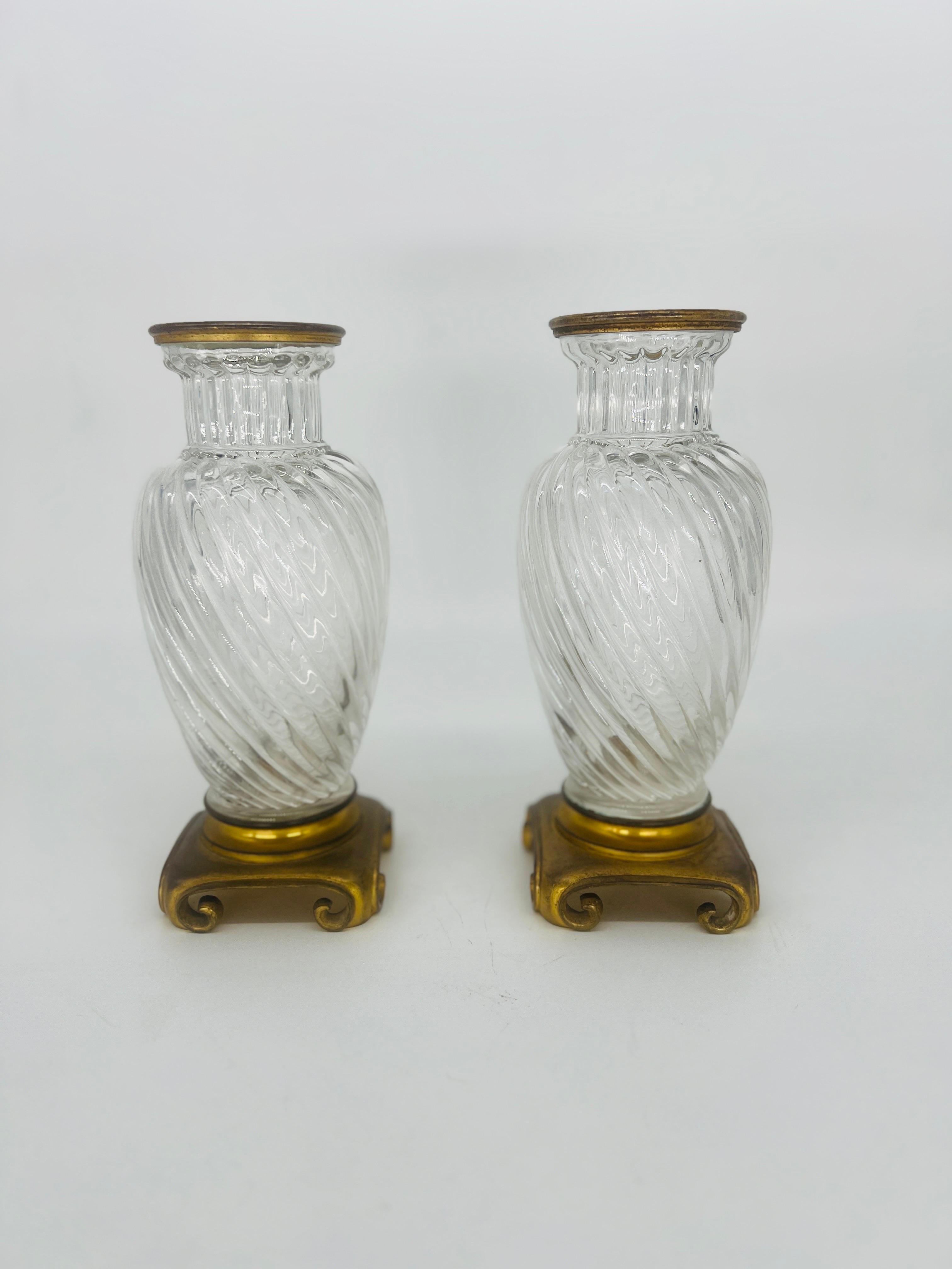 Pair, 19th century Baccarat Swirl Pattern Bronze Ormolu Mounted Crystal Vases.
These pair of 19th century French crystal vases have the iconic Baccarat swirl pattern to the body, bronze ormolu mounts to rim and mounted to a pair of chinoiserie