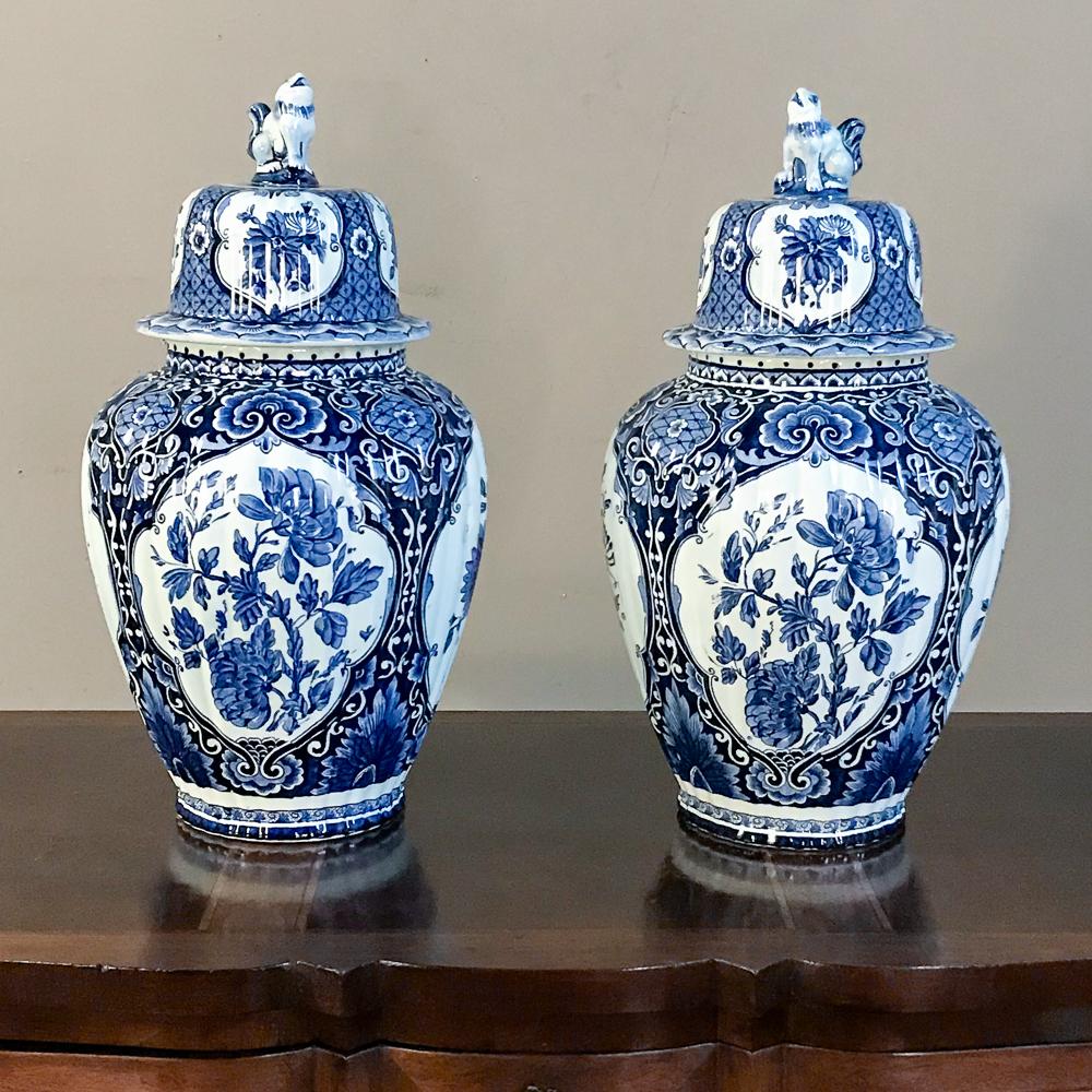 Pair of 19th century blue and white lidded vases were hand painted and survive with their lids intact to create a lovely symmetrical decorative accent for any room!
circa 1890s
Each measures 18 H x 10 in diameter.