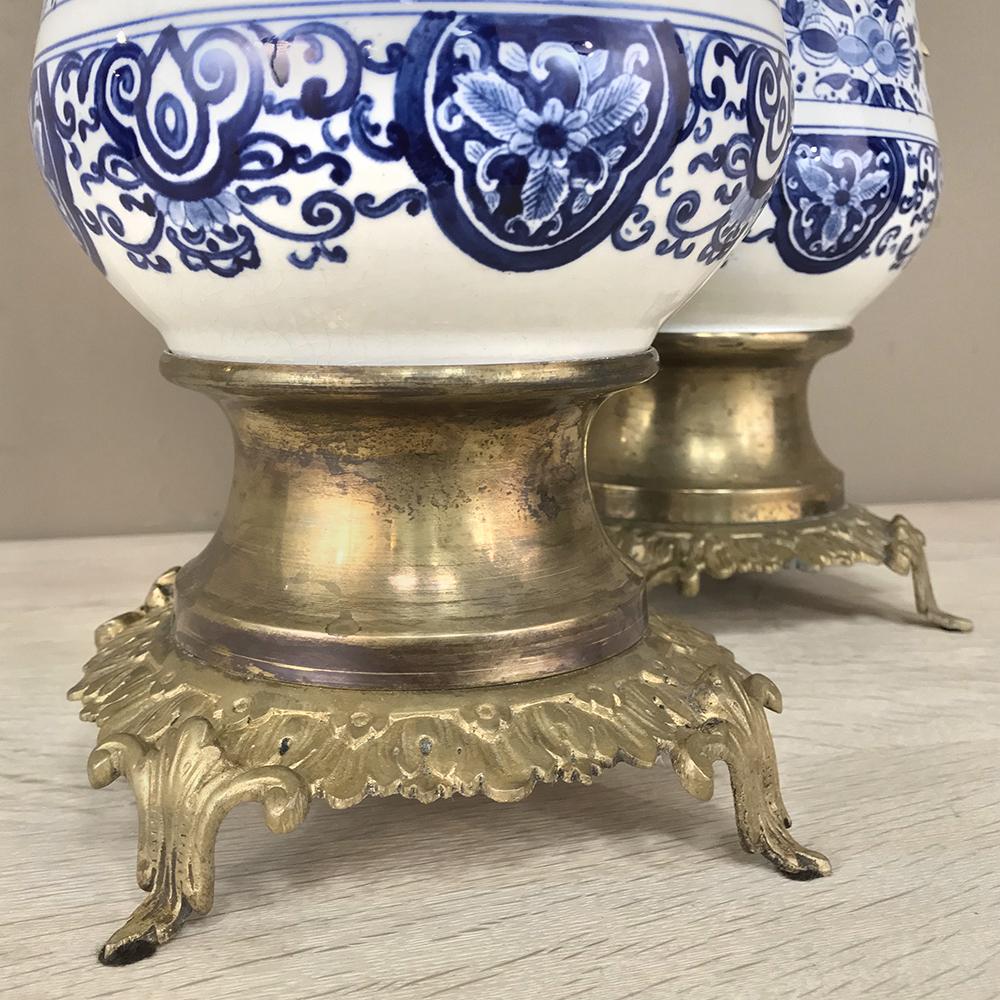Bronze Pair of 19th Century Blue and White Delft Vases with Brass