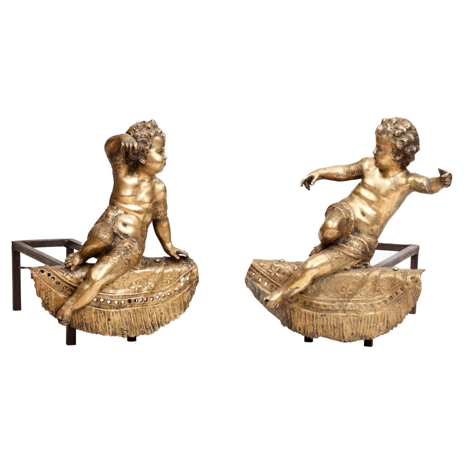 Pair of 19th Century Brass Fire Dogs Modeled as Cherubs For Sale
