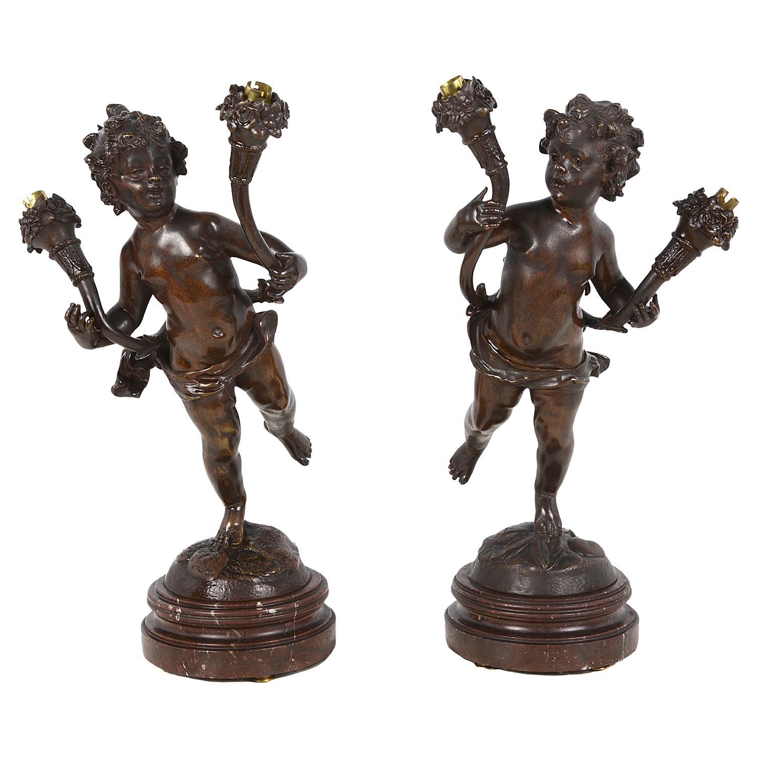 Paire de lampes à chérubin en bronze du 19ème siècle en vente