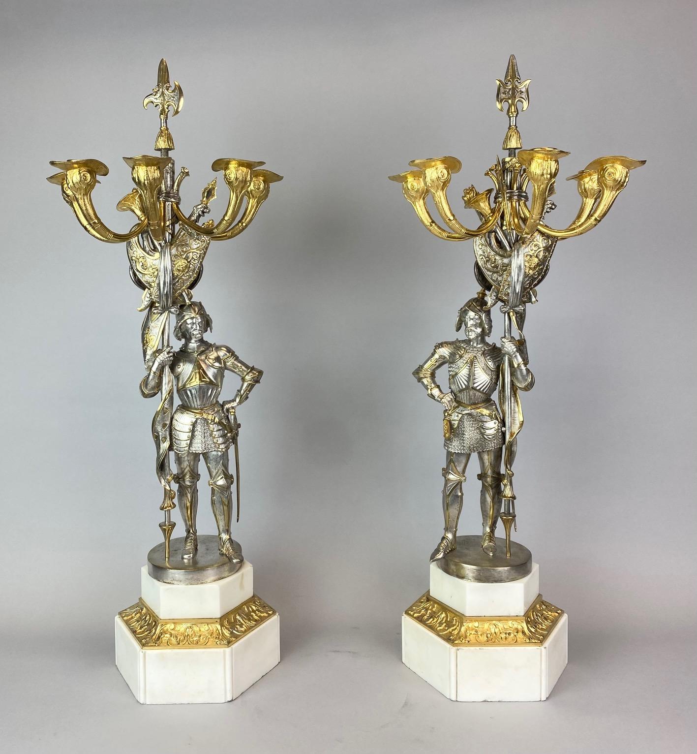 Pair 19th century Napoleon III gilded - and silver-plated bronze candelabra styled in the form of medieval knights in armor on hexagonal marble bases.
France c. 1870s

Dimensions:

H73 x W29 x D24 cm.
H28.74 x W11.42 x D9.45 inch.
