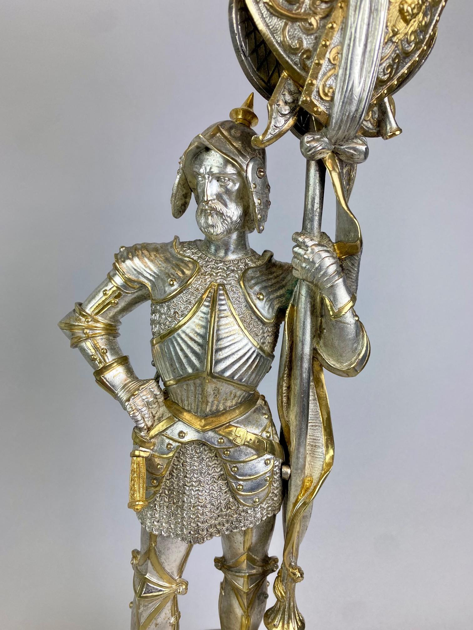 Bronzo Pair 19th century  candelabra styled in the form of medieval knights in vendita