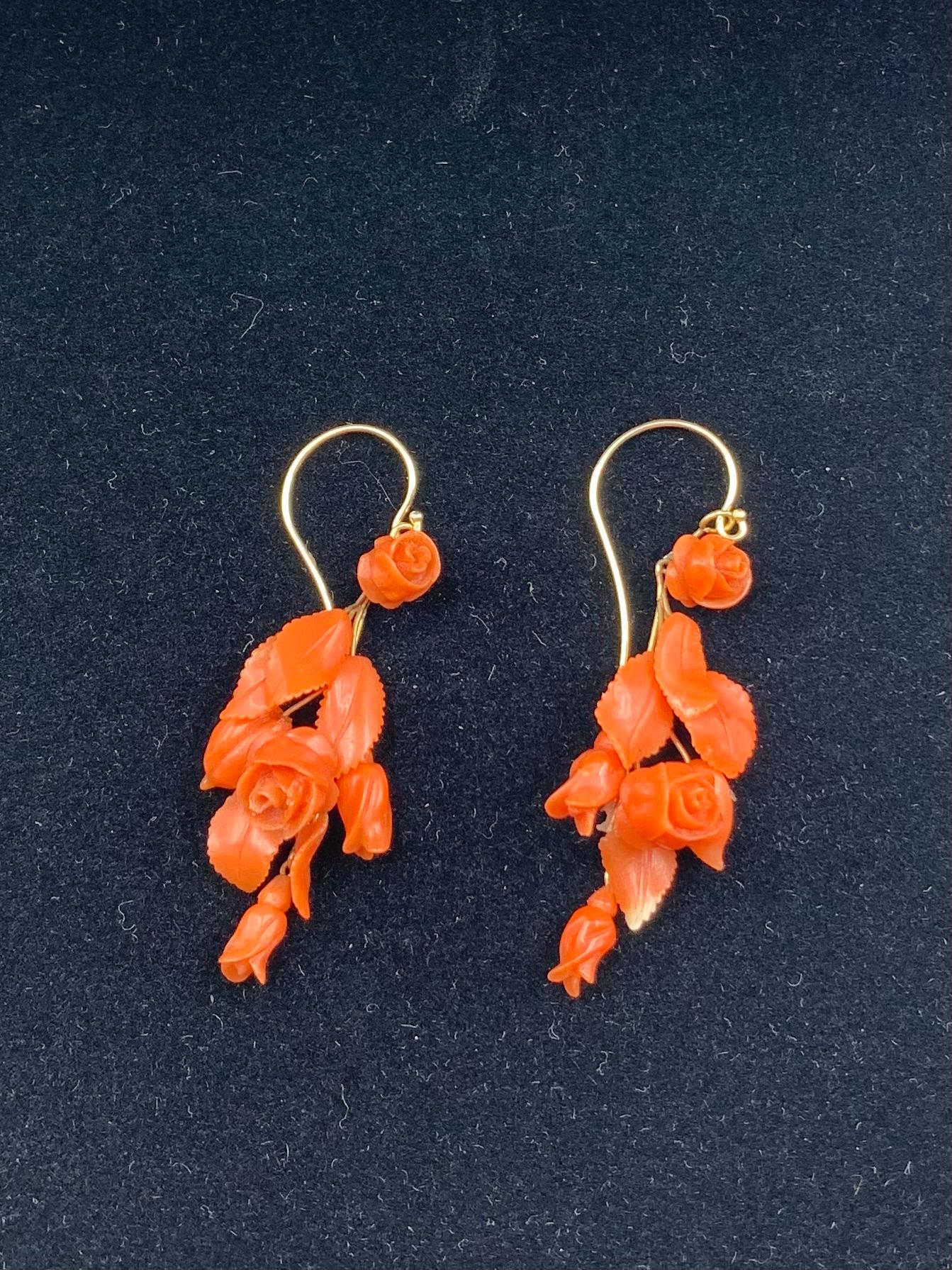 Very fine quality antique carved red coral and 14K yellow gold Rosebud earrings
19th Century
Each earring composed of delicately hand carved coral rosebuds and foliage ideal for a fabulous garden party.
Tested for 14K gold
Length: 1.88 inches
Width: